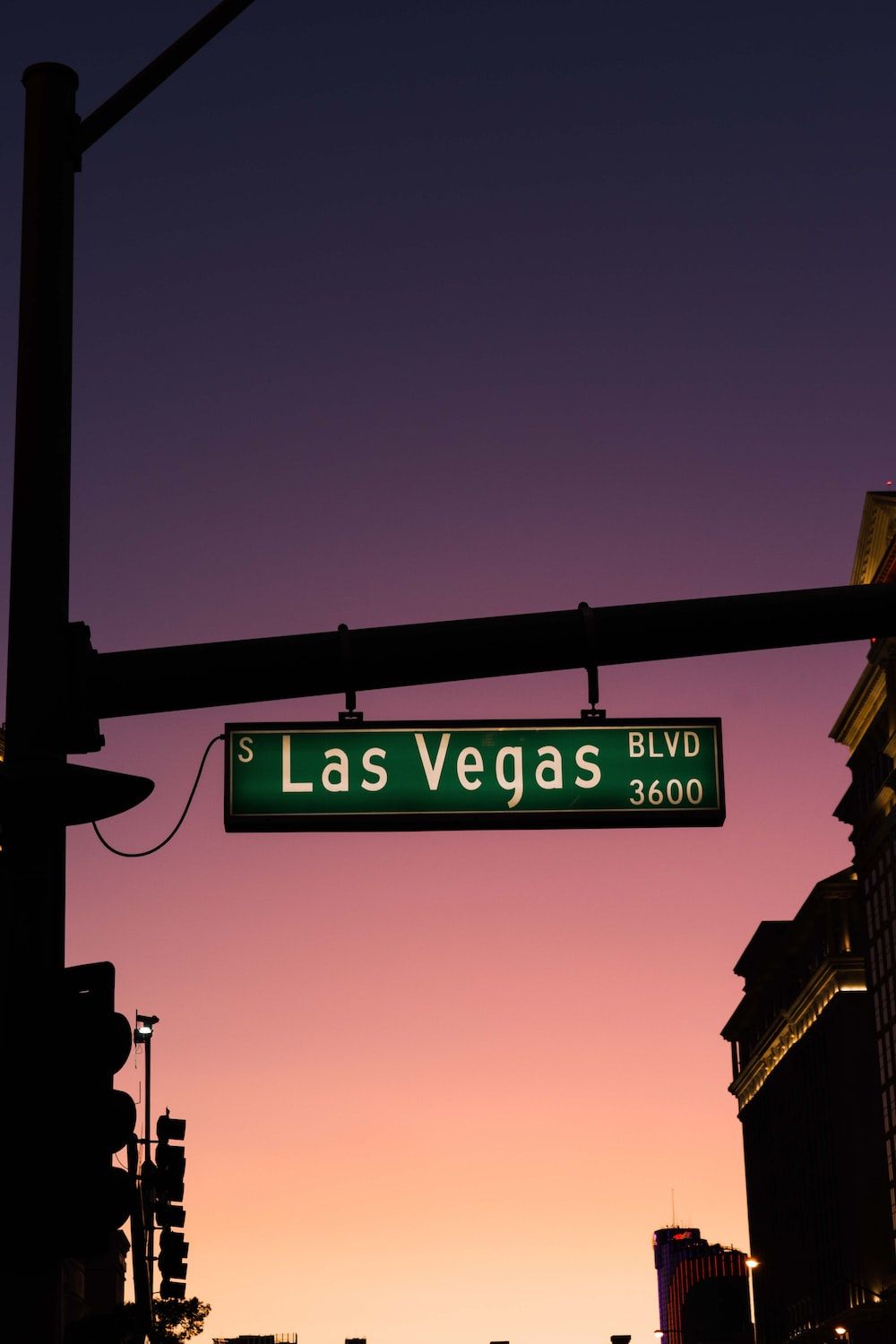 A street sign for Las Vegas Blvd at sunset. - Las Vegas
