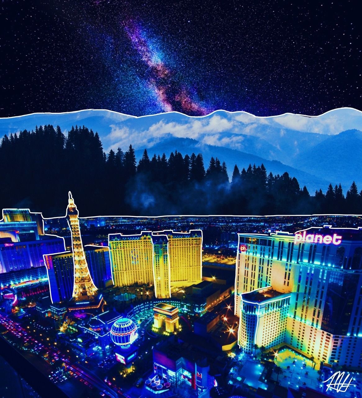 A city at night with bright lights and mountains in the background - Las Vegas
