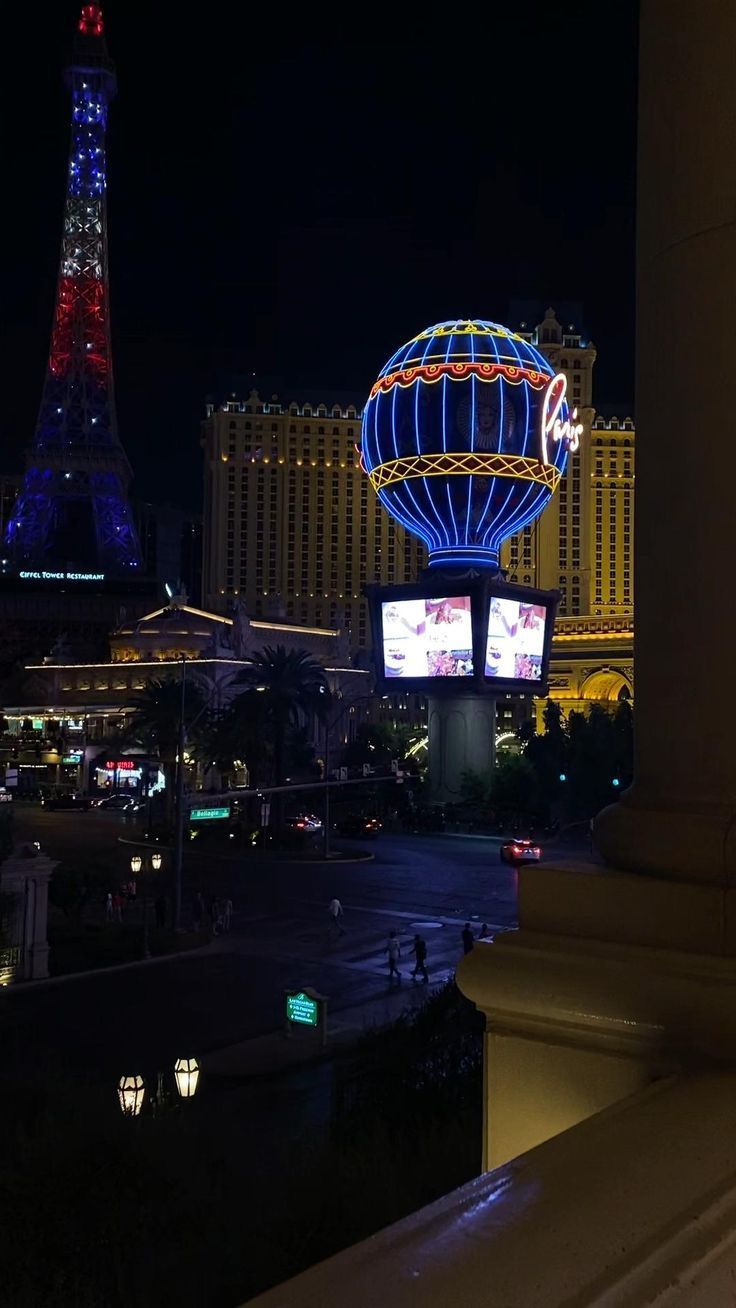 A night time view of the Paris Hotel and Casino in Las Vegas. - Las Vegas