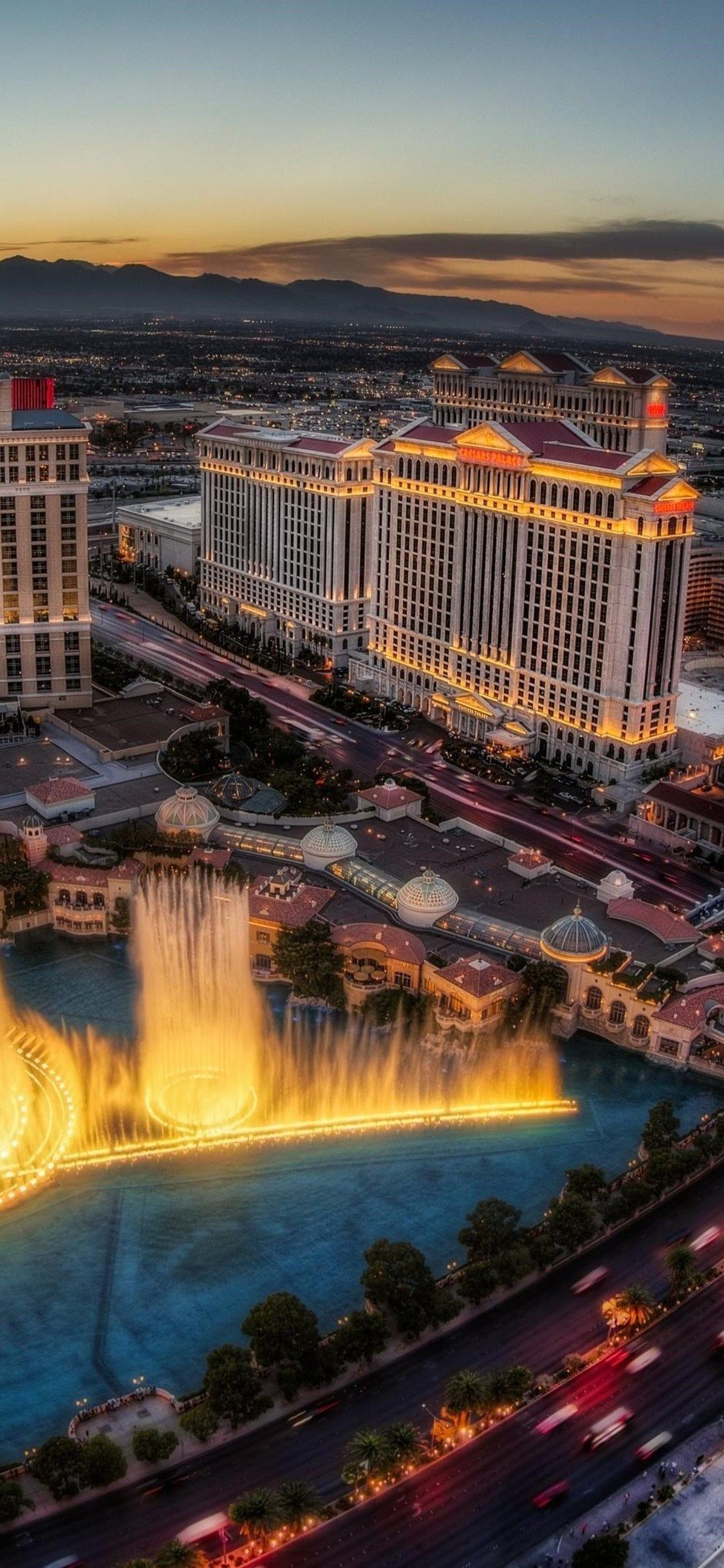 The fountains of bellagio are lit up at night - Las Vegas