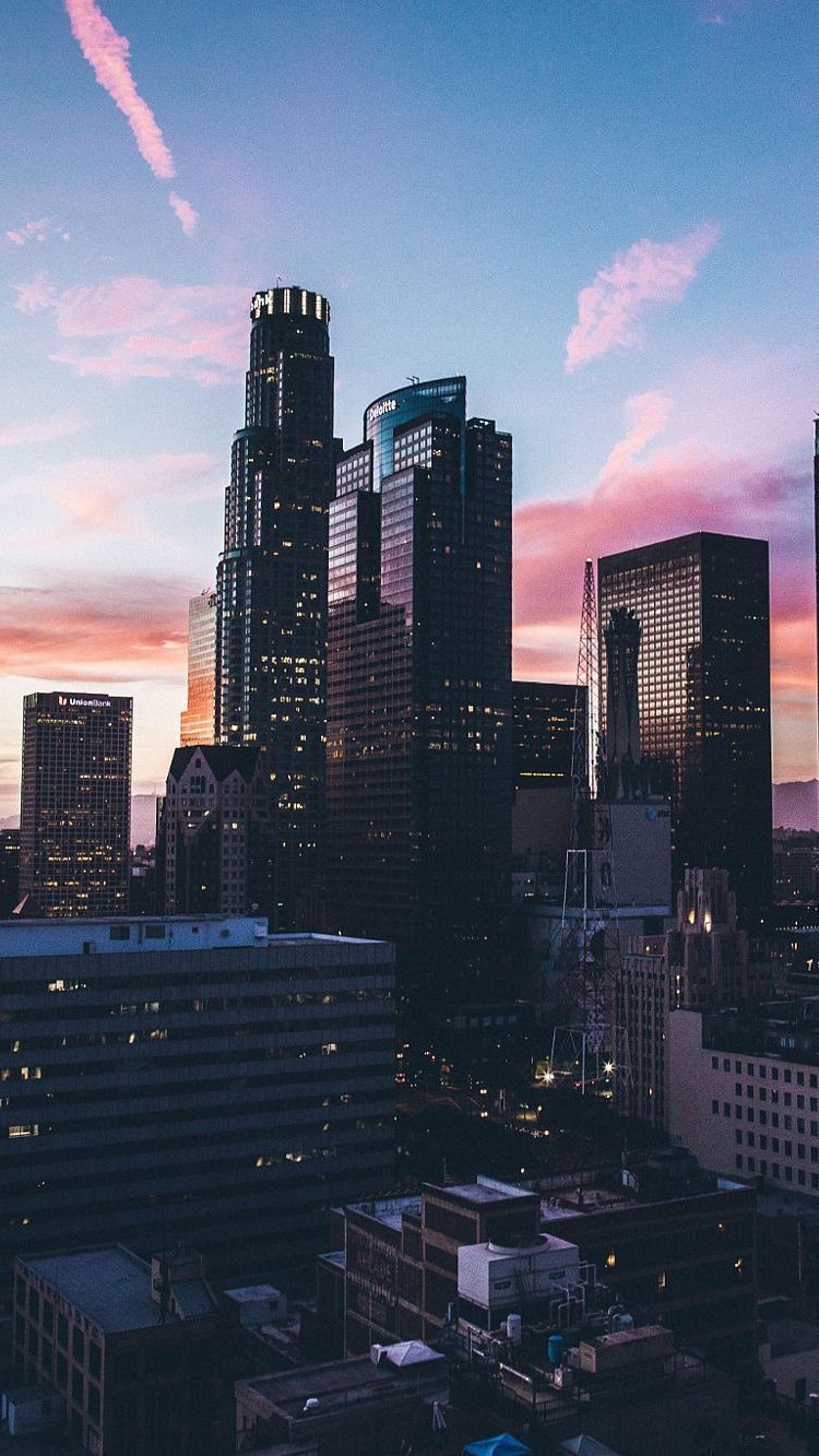 A city skyline at sunset with buildings and skyscrapers - Los Angeles