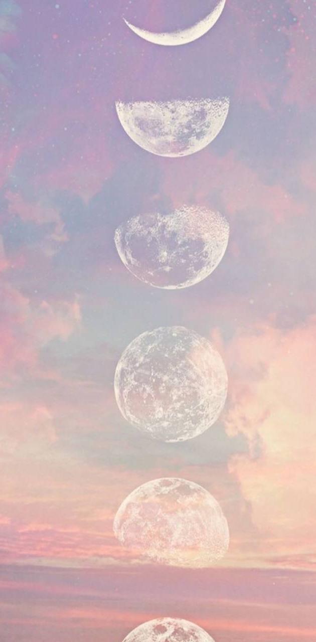 Moon phases in a row with clouds and pink sky - Moon phases