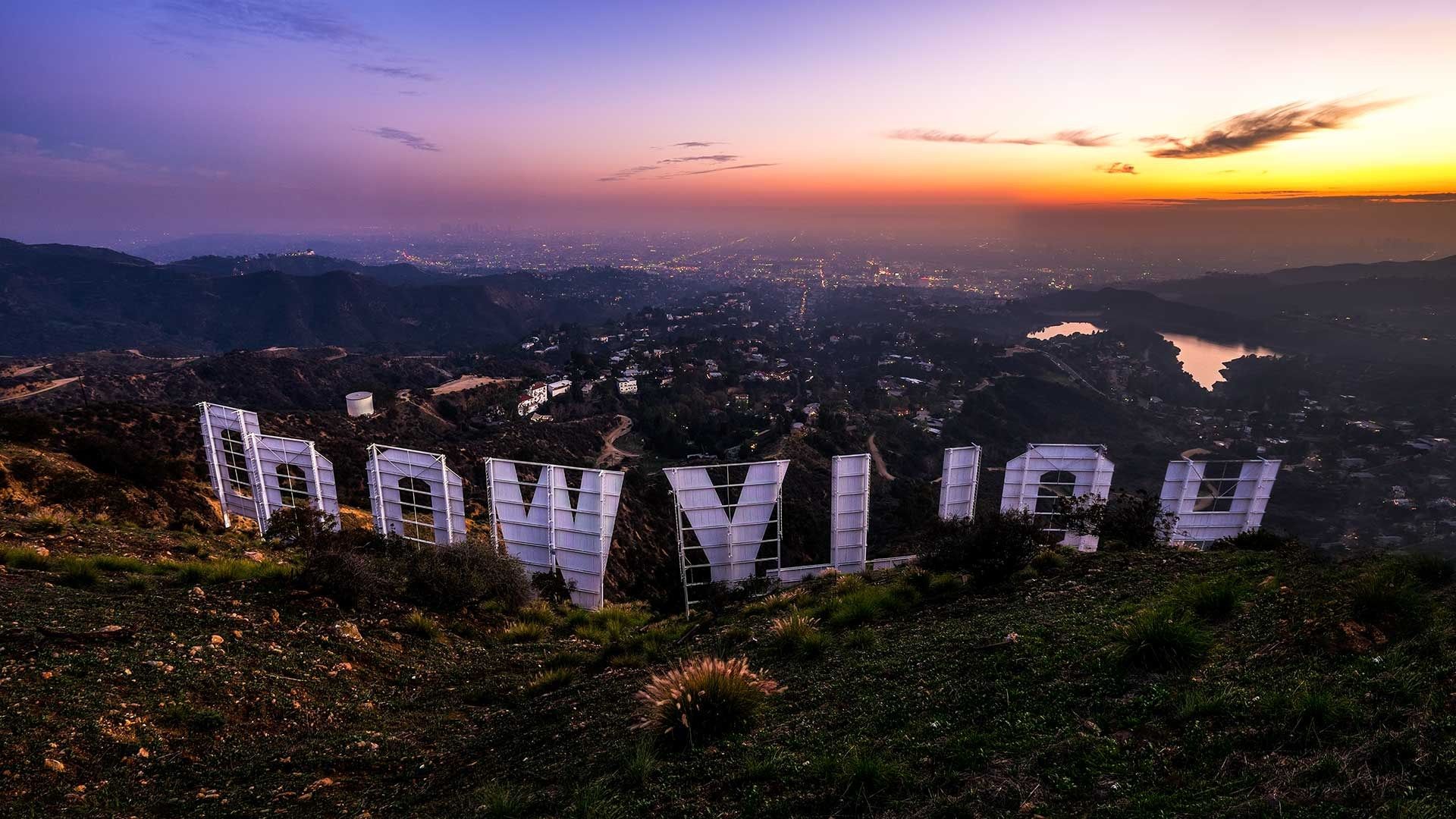 A sunset view of the hollywood sign - Los Angeles