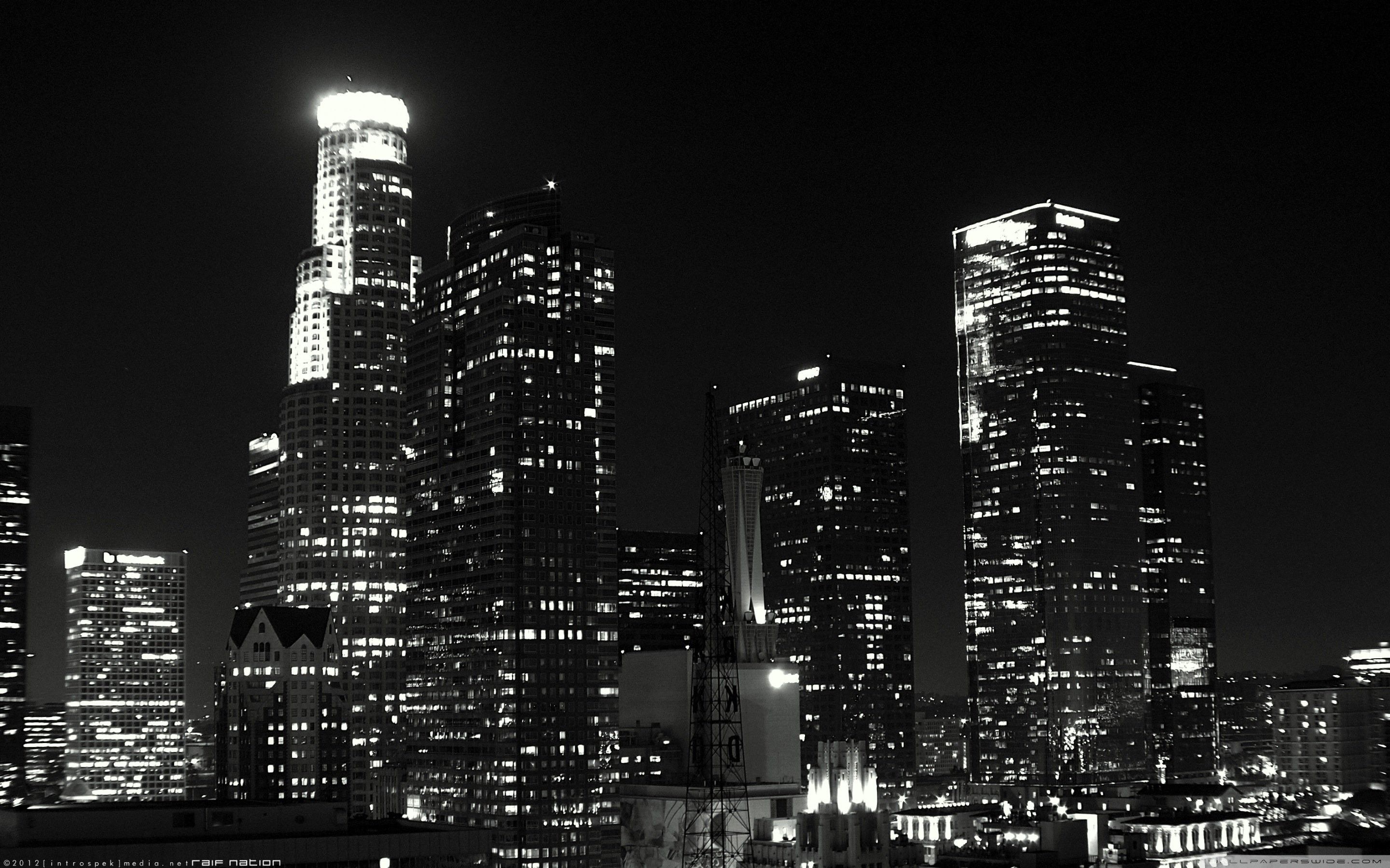 A black and white photo of the Los Angeles skyline at night. - Los Angeles