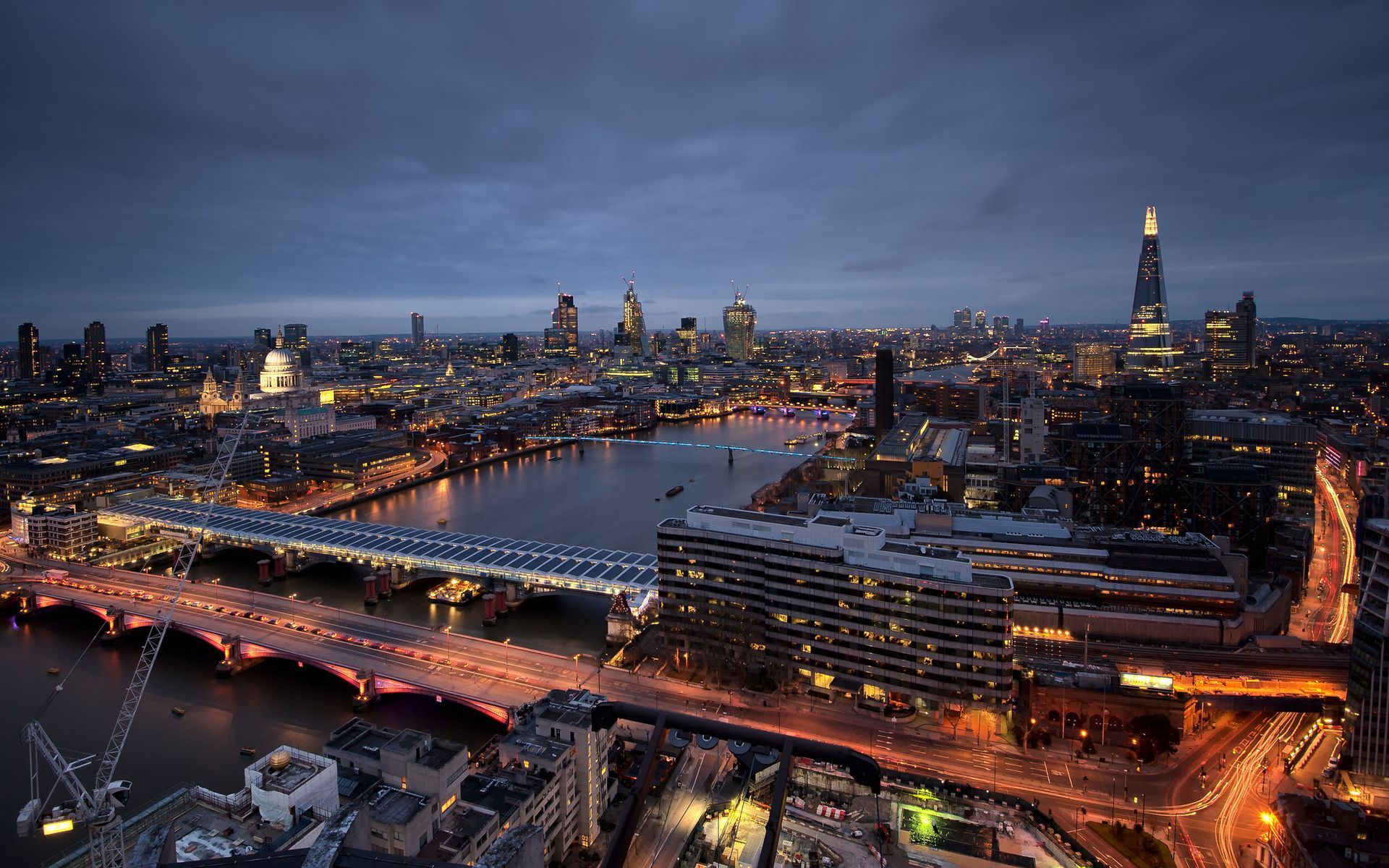 A city with many tall buildings and bridges - London