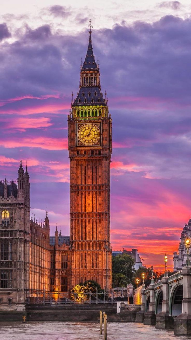 A large clock tower on top of the building - London