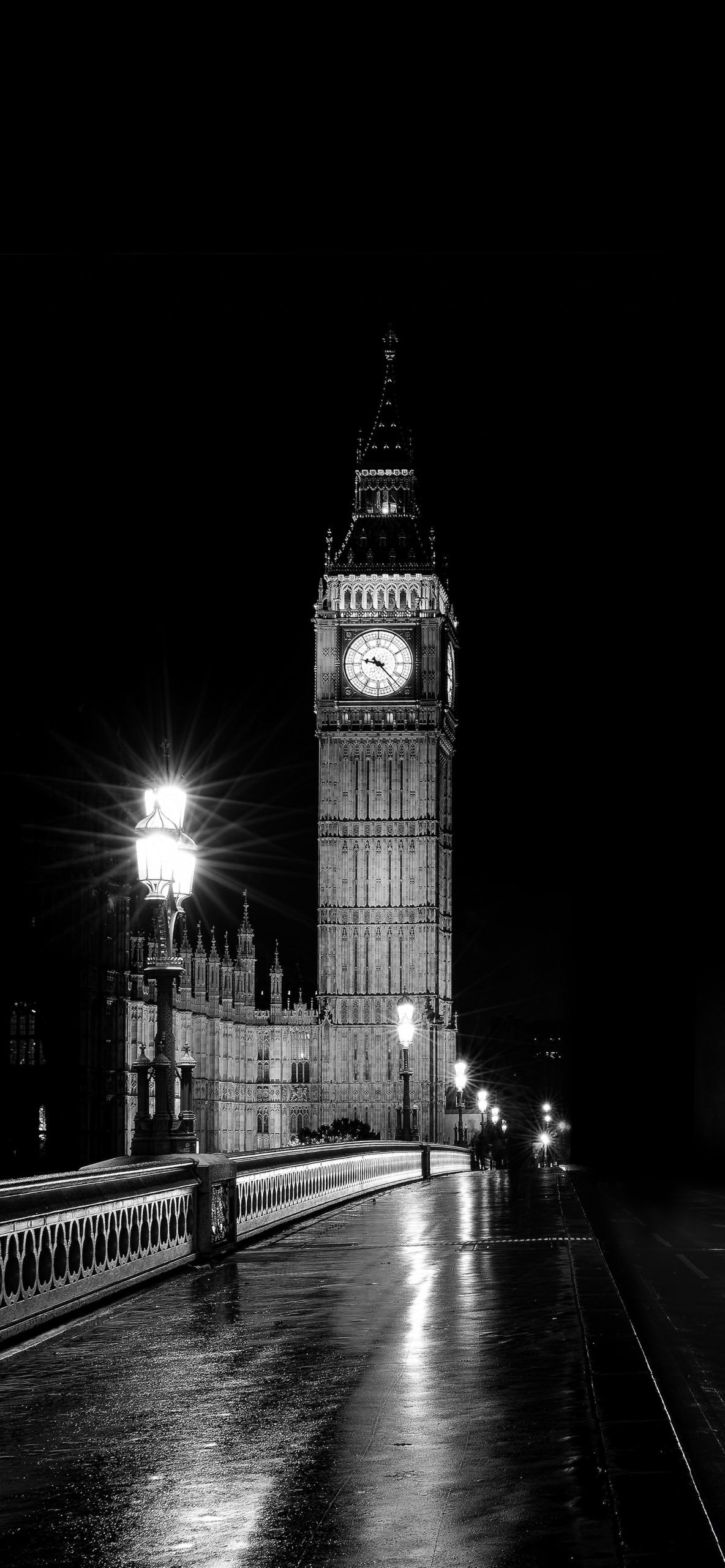 A black and white photo of Big Ben in London at night. - London