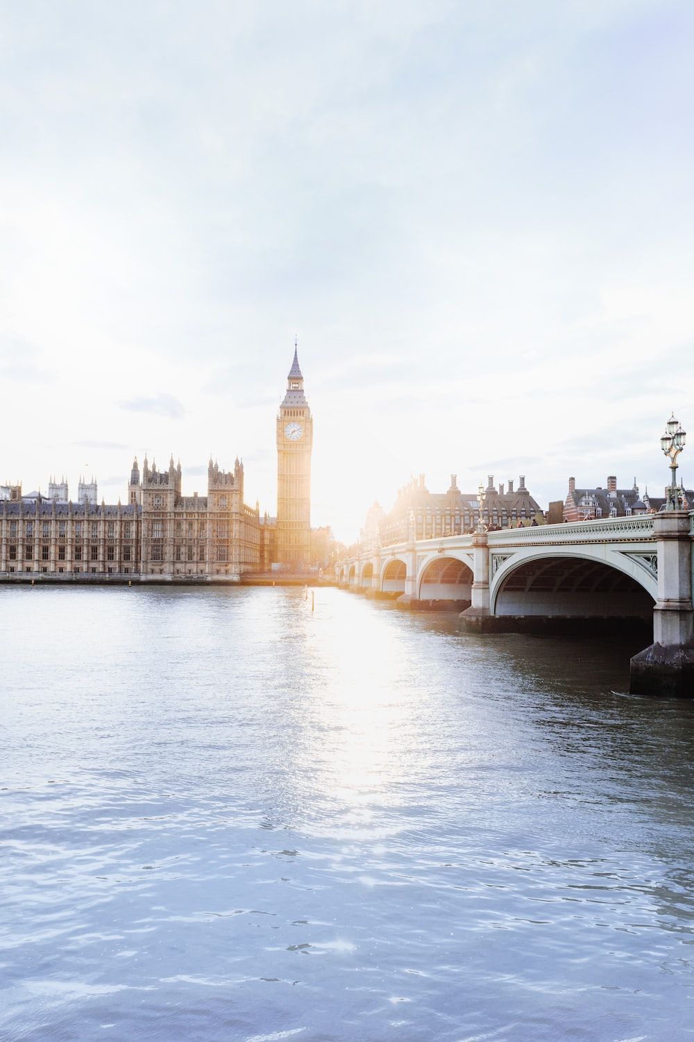 A bridge over water with buildings in the background - London