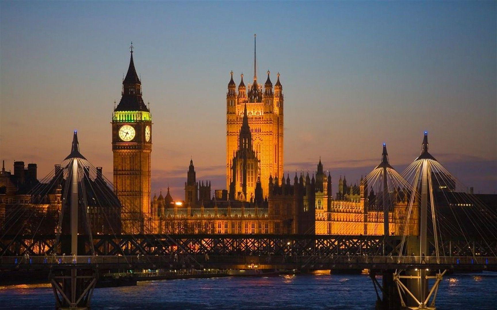 The Houses of Parliament, Big Ben, and Hungerford Bridge at night. - London