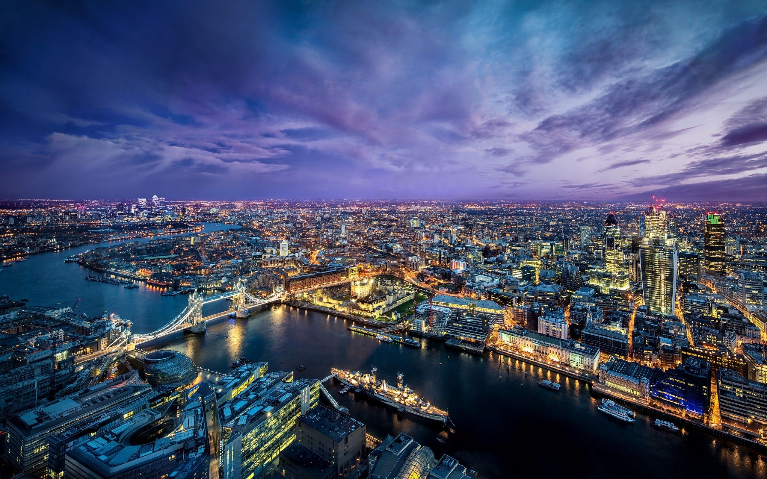 A city skyline at night with clouds - London