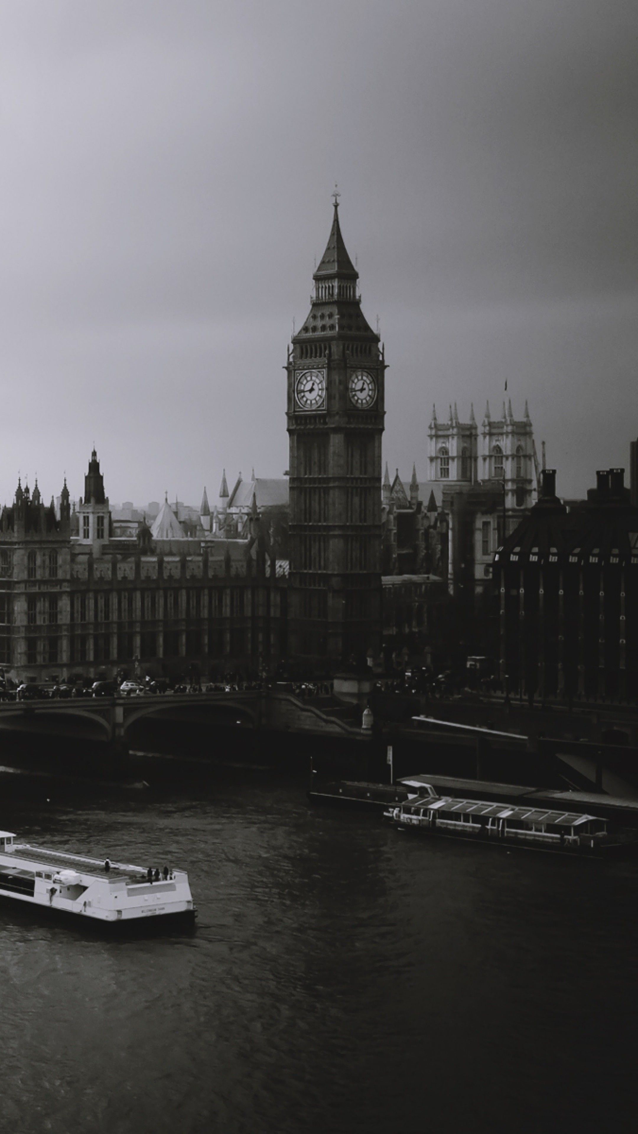 As a black and white photo of boats on the river - London