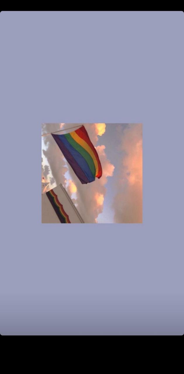 A rainbow flag is flying in the sky - LGBT