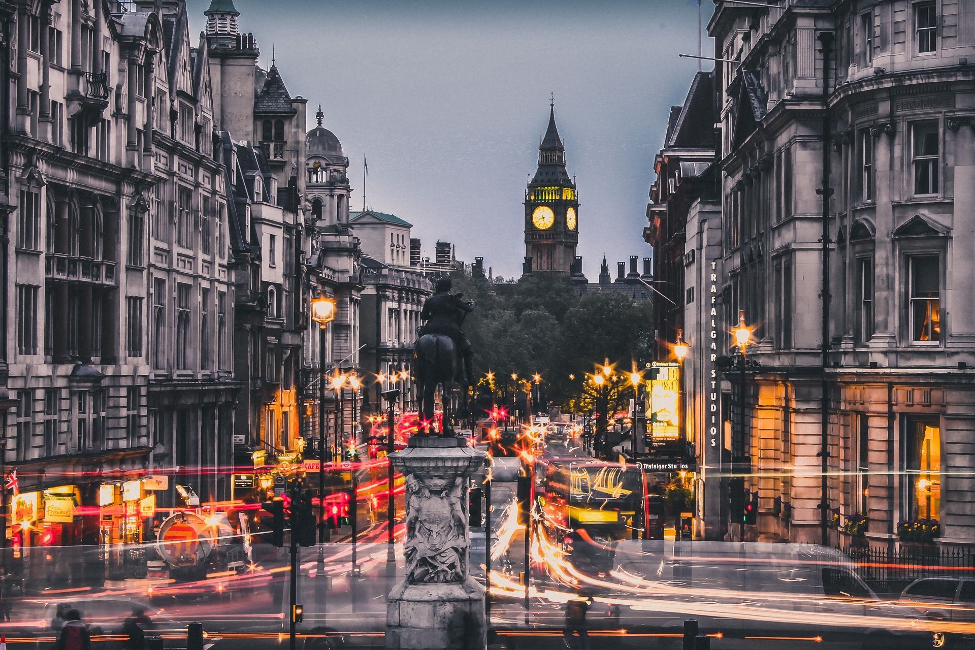 A busy street in London with a clock tower in the background - London