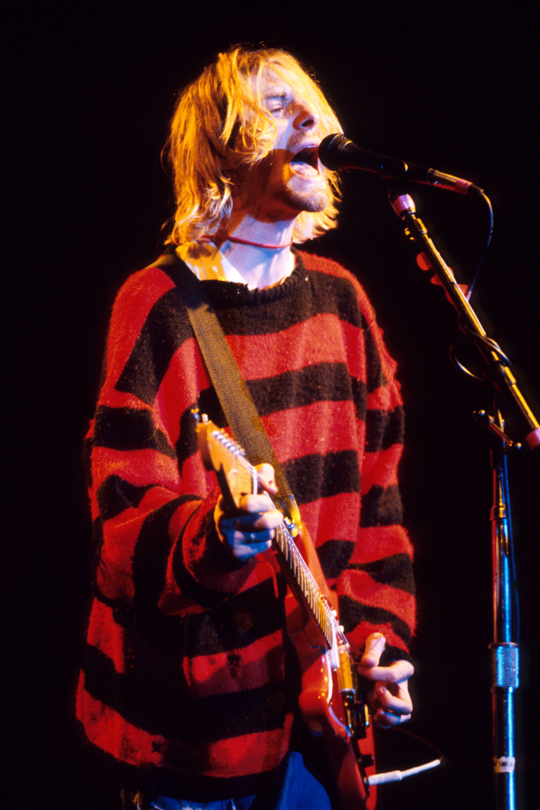 Kurt Cobain of Nirvana performs on stage at the Reading Festival in 1992 - Nirvana