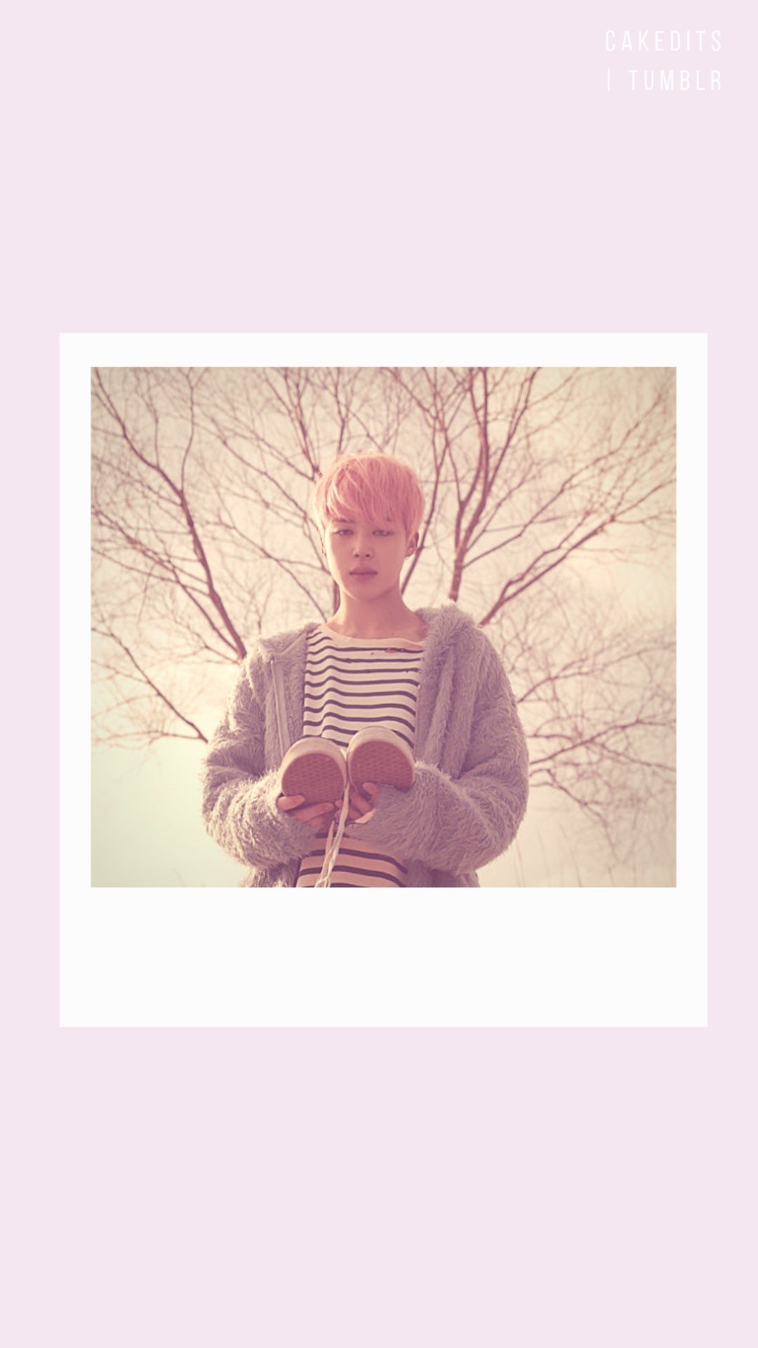 A girl with pink hair is standing in front of trees - Polaroid