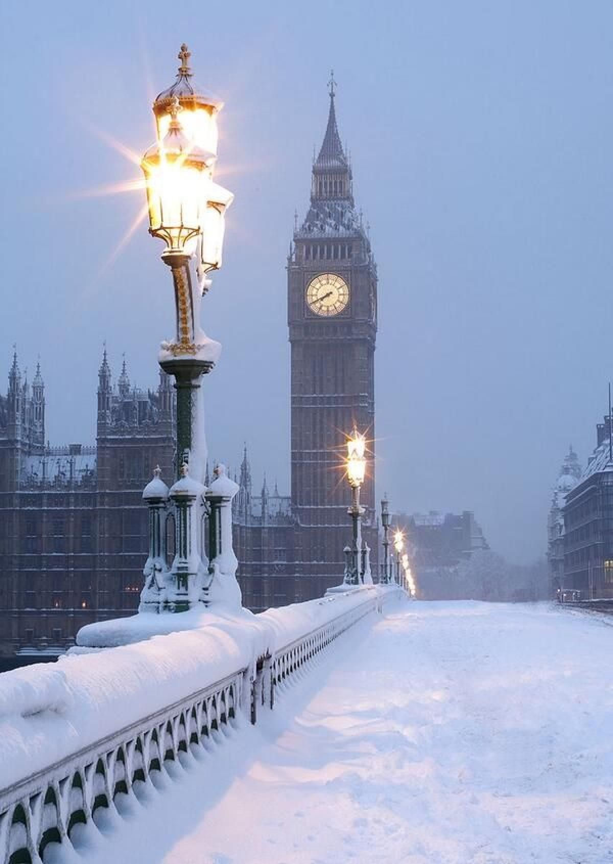 Snow covered bridge with Big Ben in the background - London