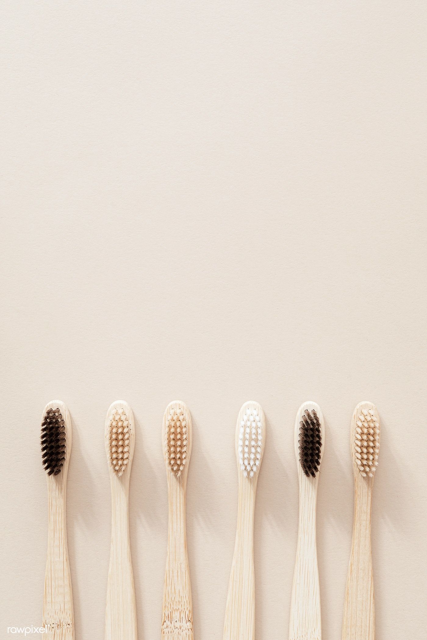 Bamboo toothbrushes on a beige background. premium image / Karolina / Kaboompics. Brushing teeth, Dental wallpaper, Dental aesthetics
