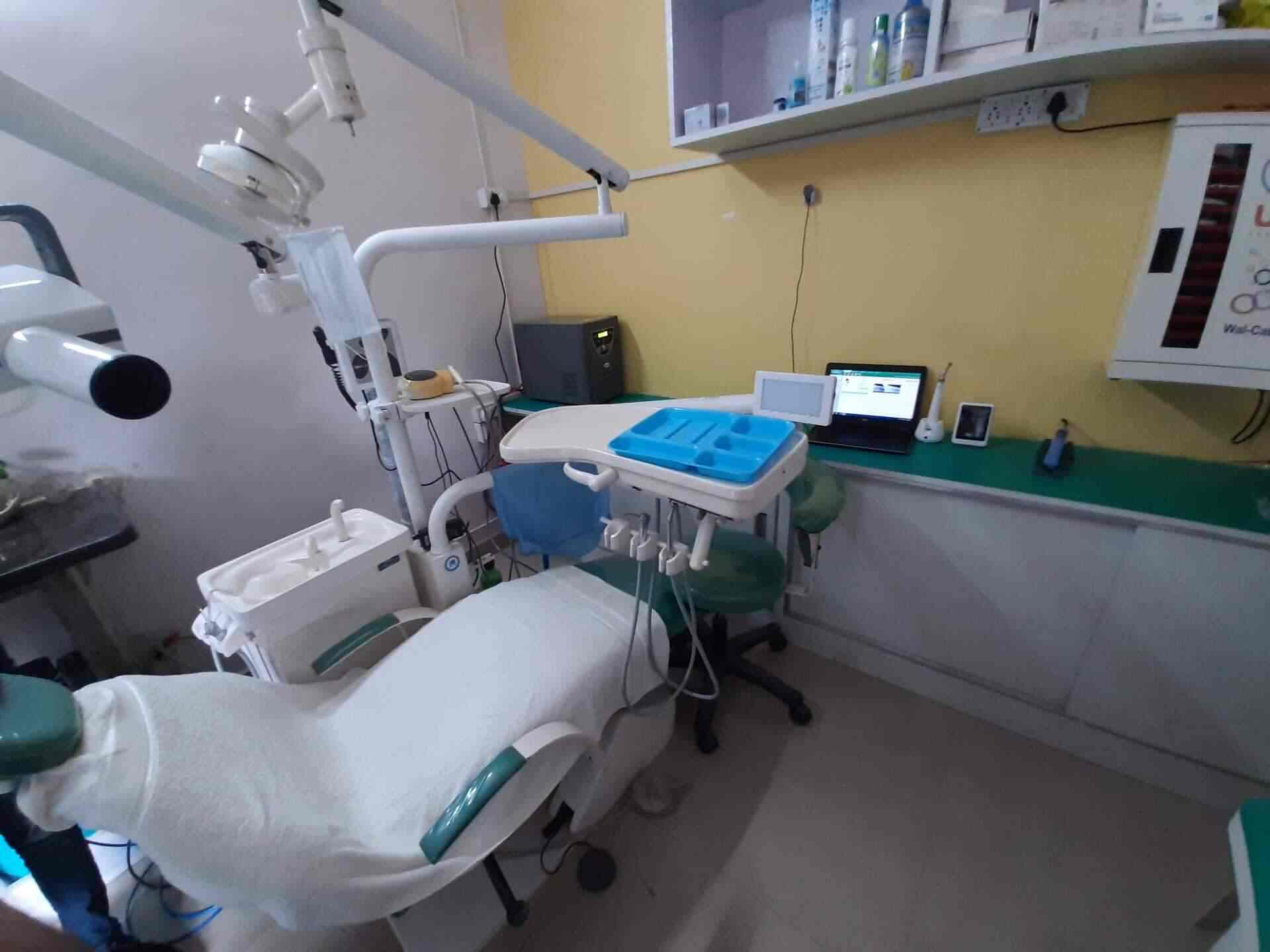 A dental office with chairs and equipment - Dentist