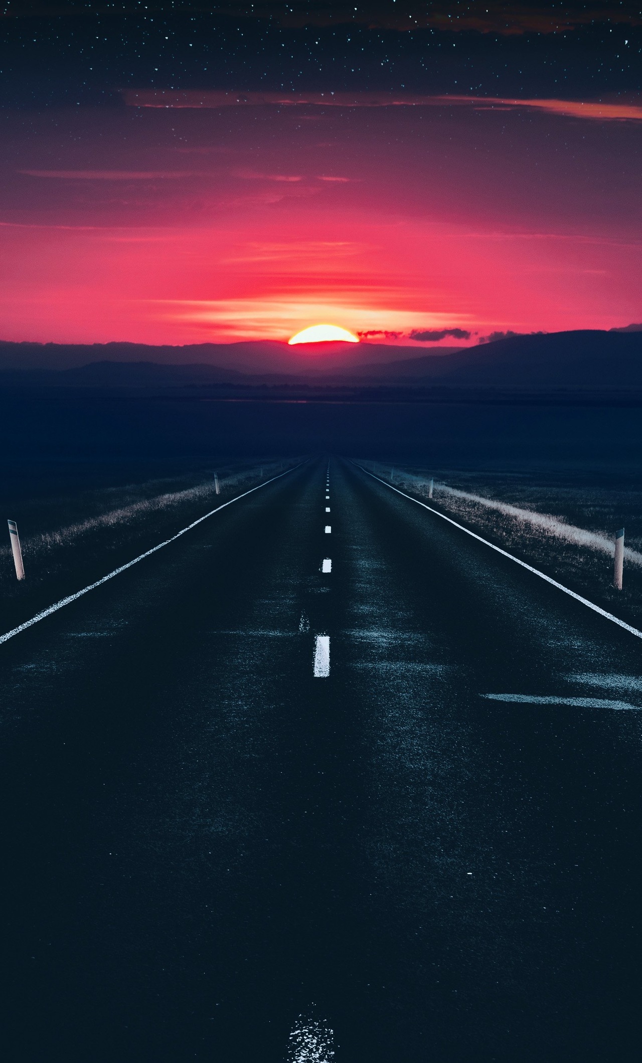 A road at sunset with a red sky - Road