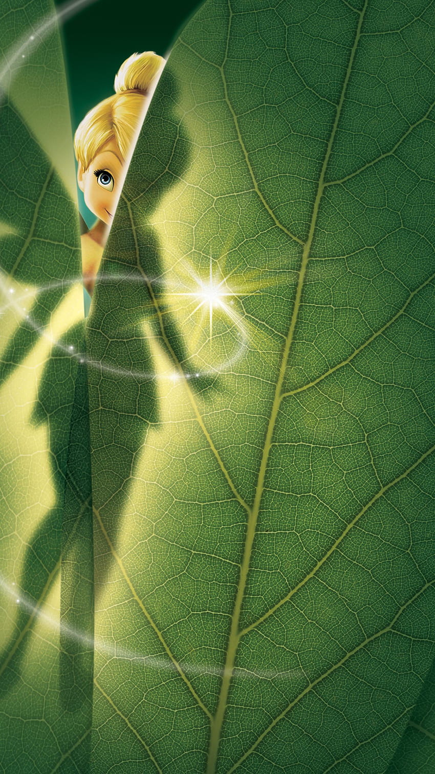 Tinker Bell peeks out from behind a leaf in the movie poster for Tinker Bell and the Great Fairy Rescue. - Tinkerbell
