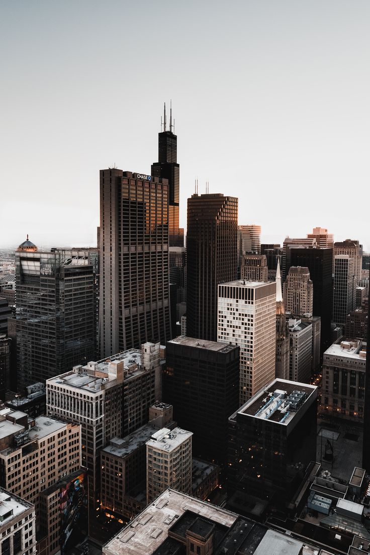 A city skyline with tall buildings and cars - Chicago