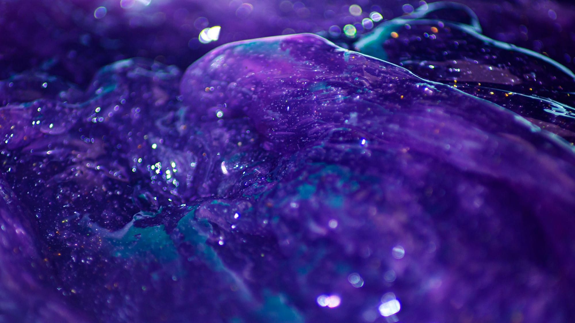 A close up of a purple and blue abstract painting. - Slime