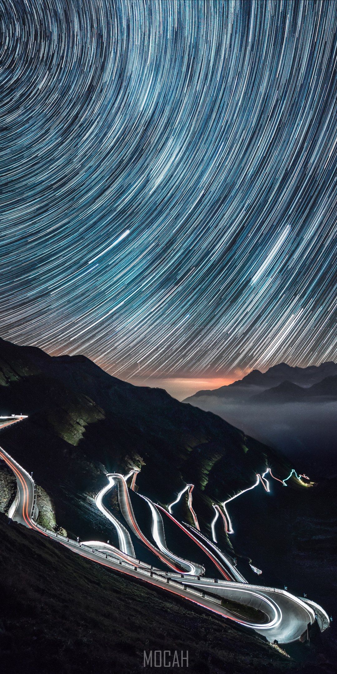 a time lapse shot of a winding highway starry sky and mountains making a brightly lit effect, passo dello stelvio italy, Realme 6S wallpaper full hd, 1080x2400 Gallery HD Wallpaper