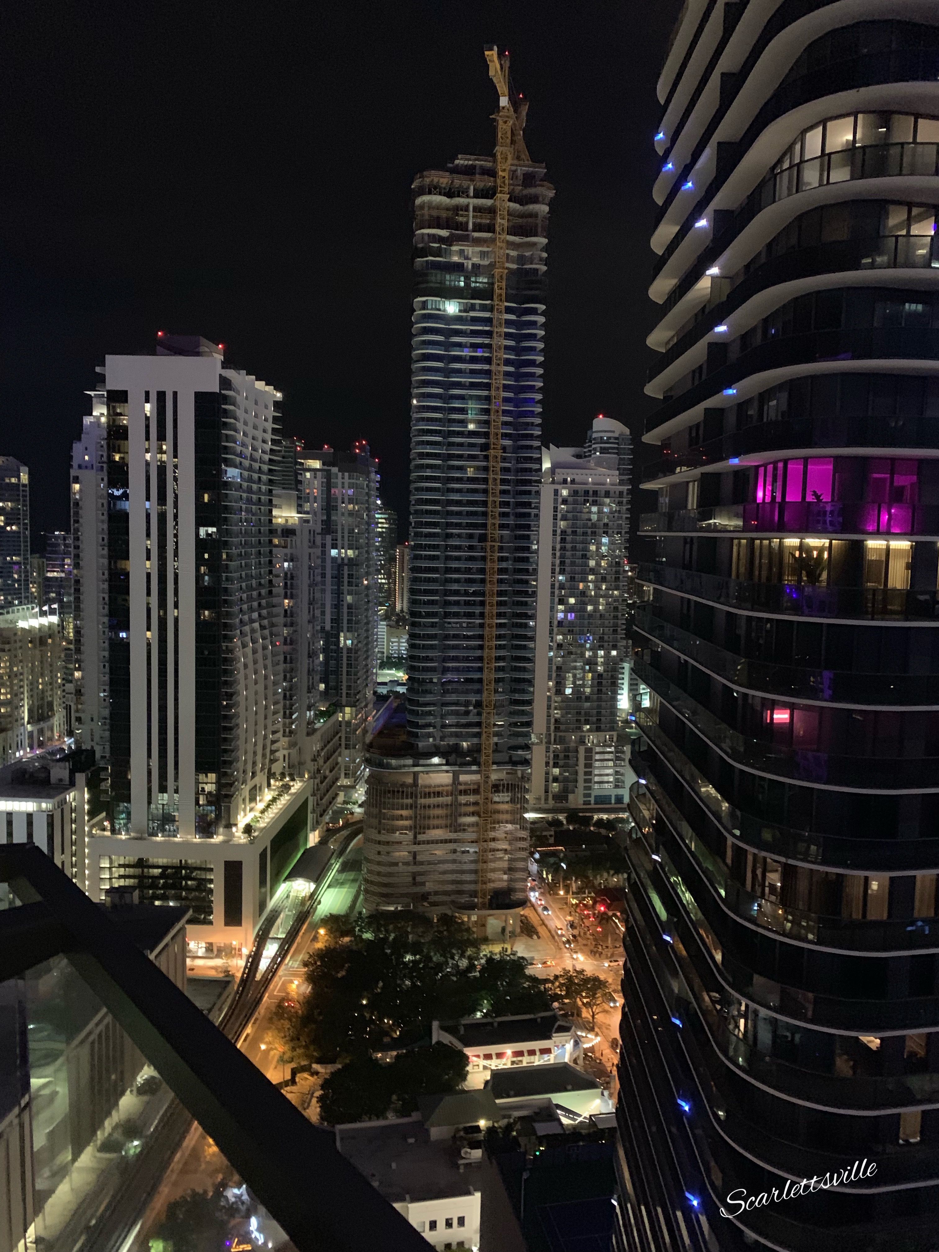 A view of Brickell Key at night from a rooftop bar in Miami. - Miami