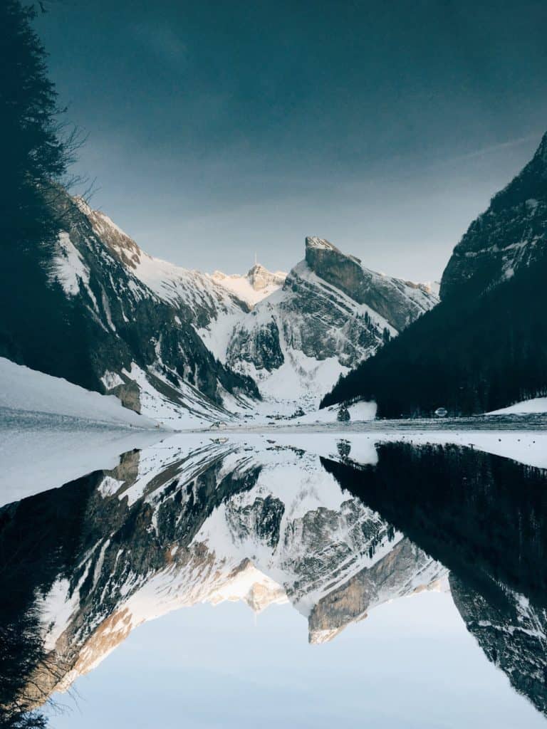 A snow covered mountain is reflected in a lake - Winter, lake