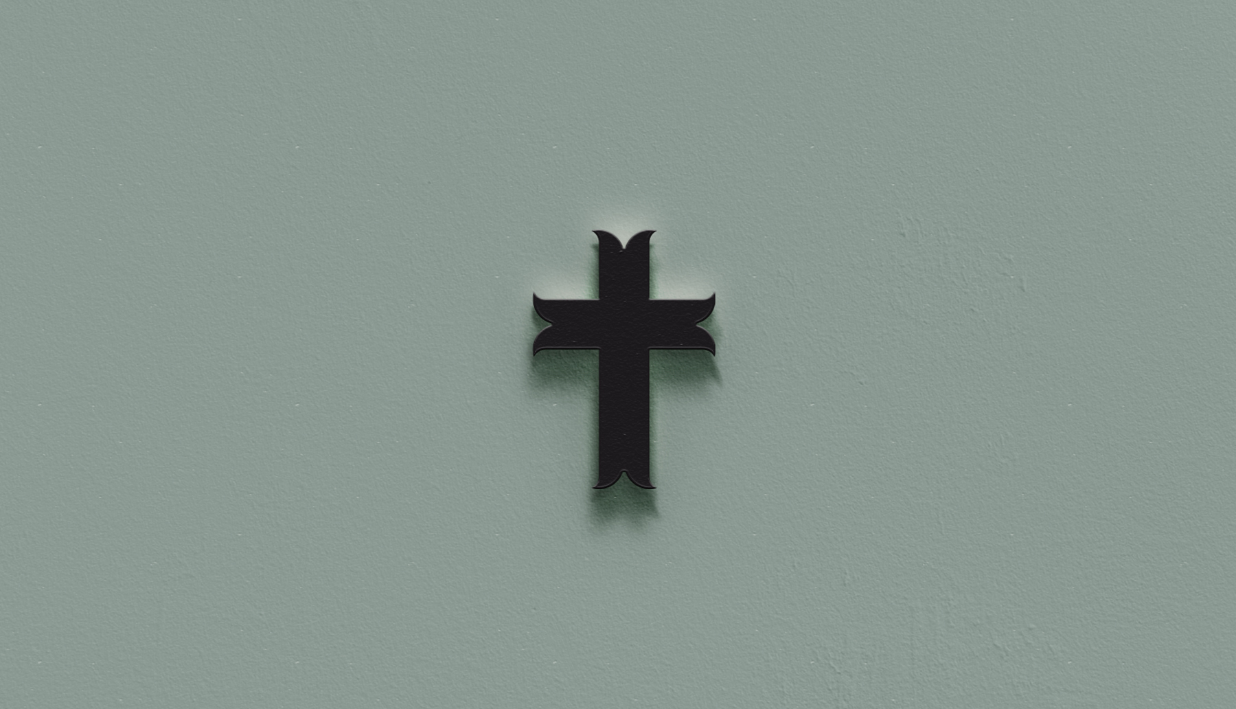 A black cross on a green wall - Cross