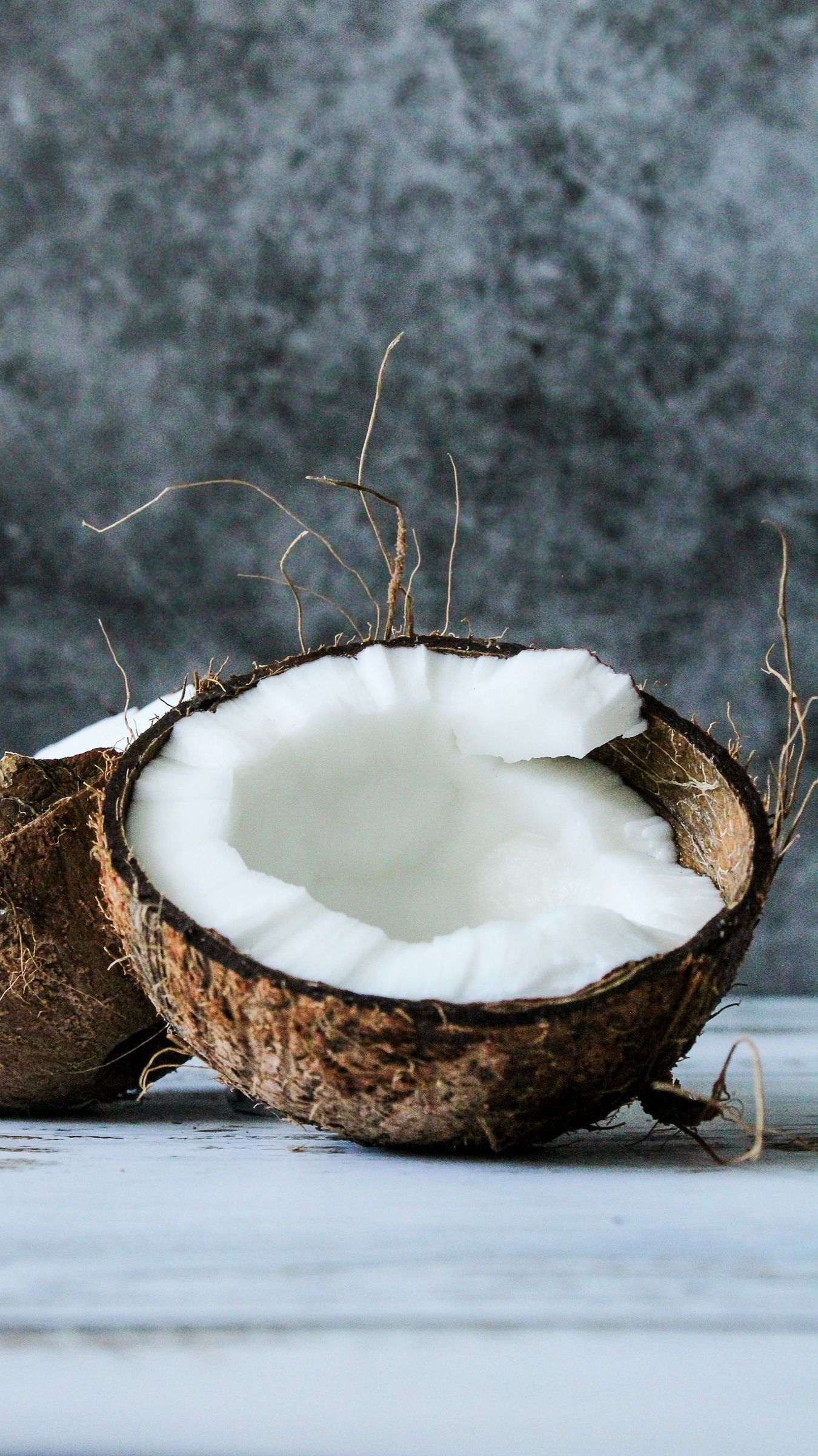 A coconut that is cut in half - Coconut