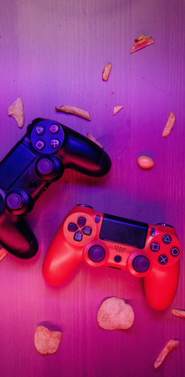 Red and blue playstation controllers on a purple background - Gaming