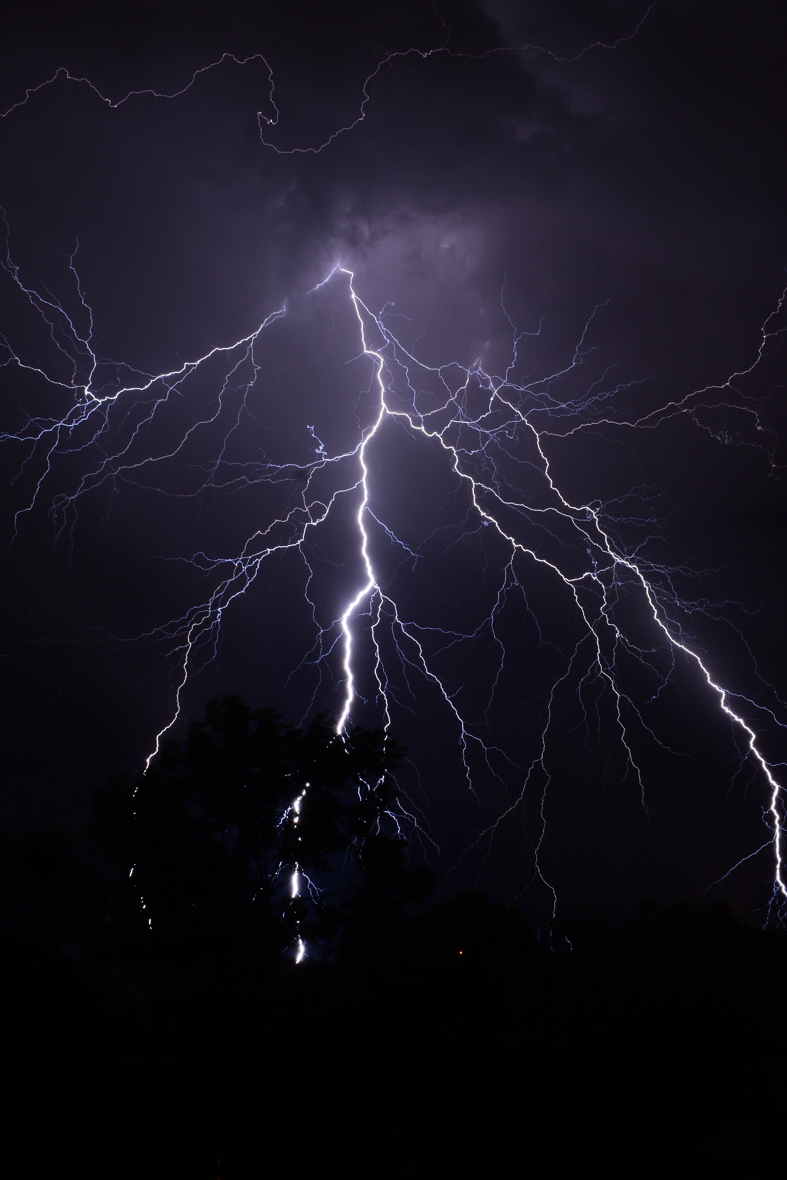 A group of lightning bolts strike in the sky - Lightning, storm