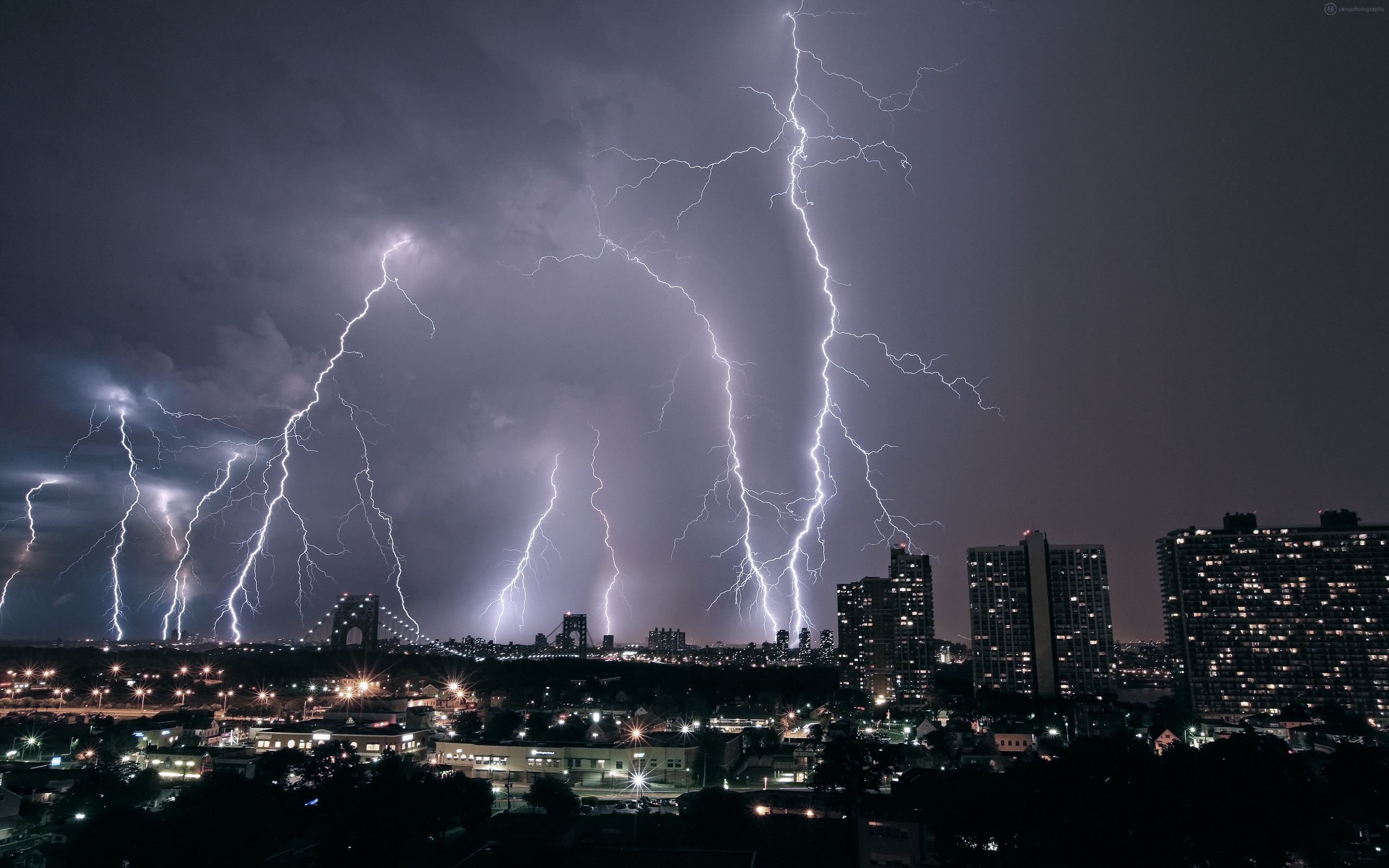 A city skyline with lightning in the background - Lightning, storm