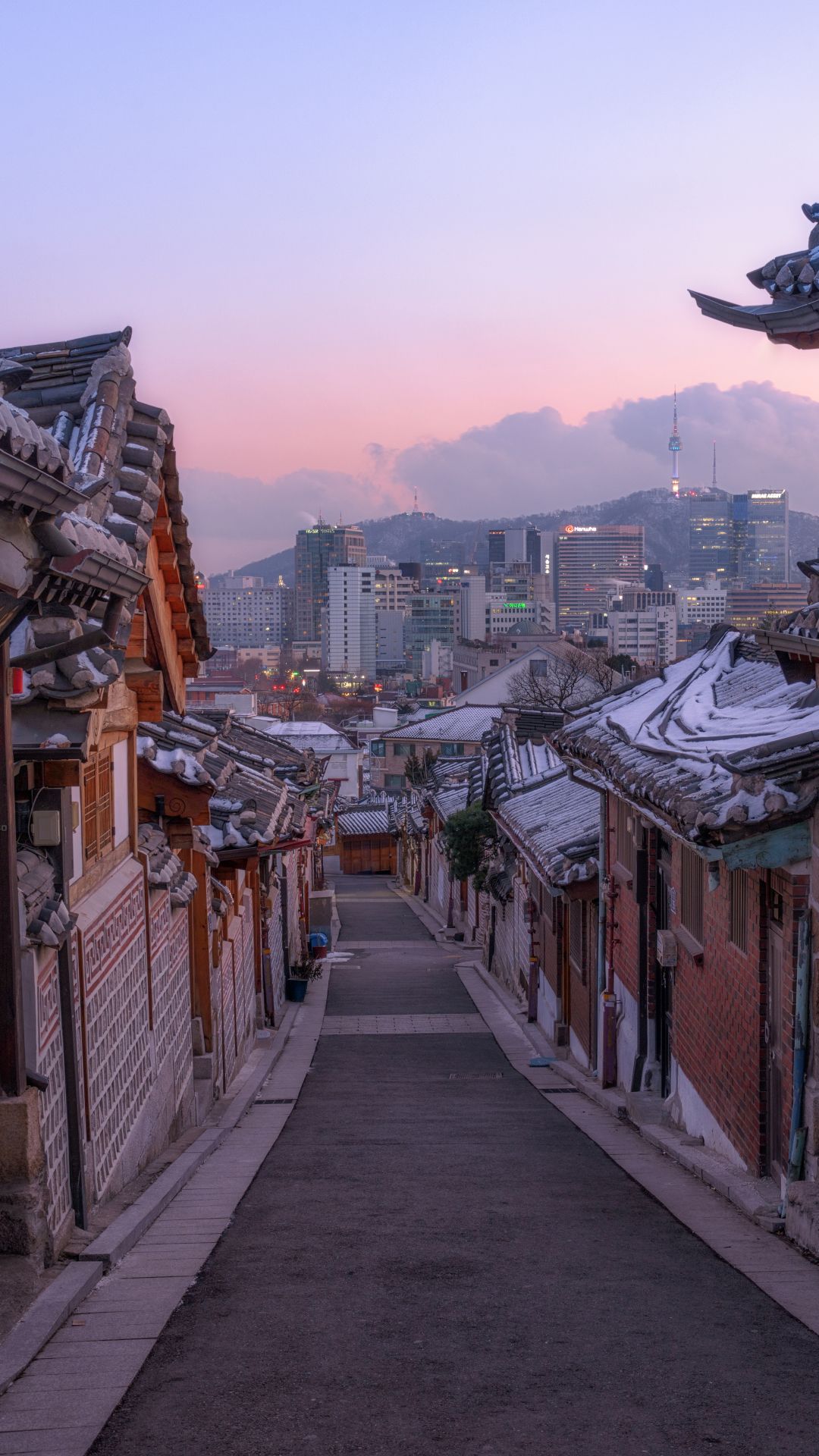 A street with buildings and snow on the ground - Seoul, Korean