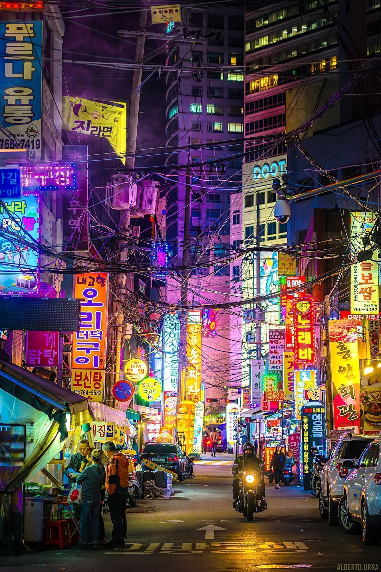 A city street with many neon lights - Seoul