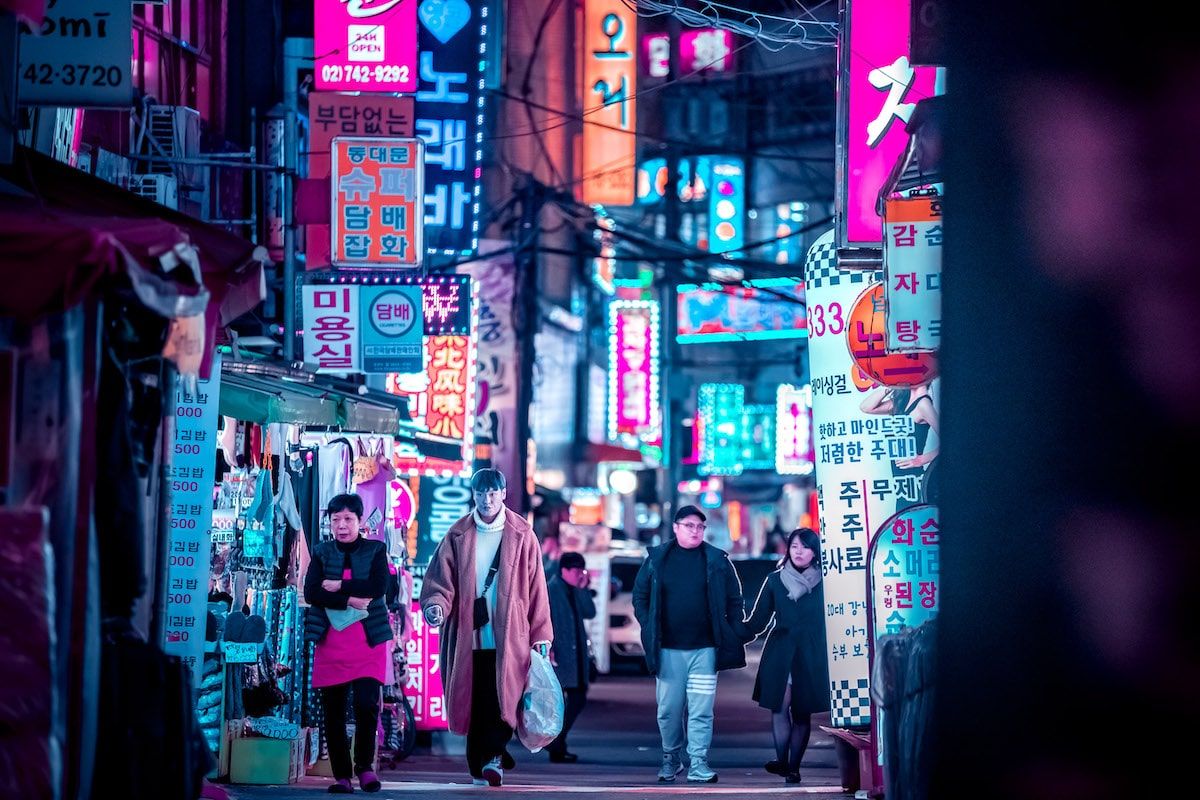 A group of people walking down an alley - Seoul