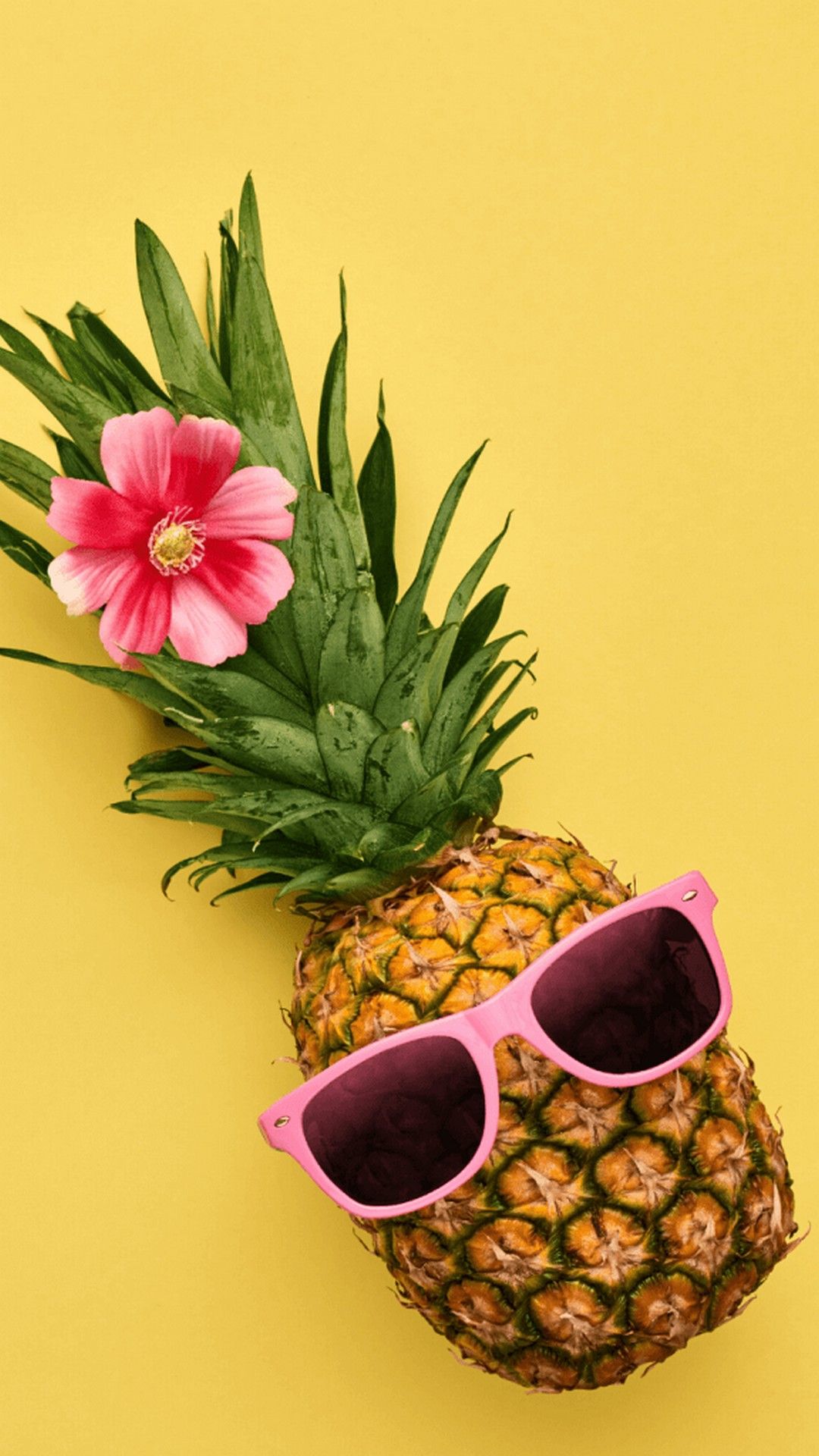 Pineapple with pink glasses and flower on a yellow background - Pineapple