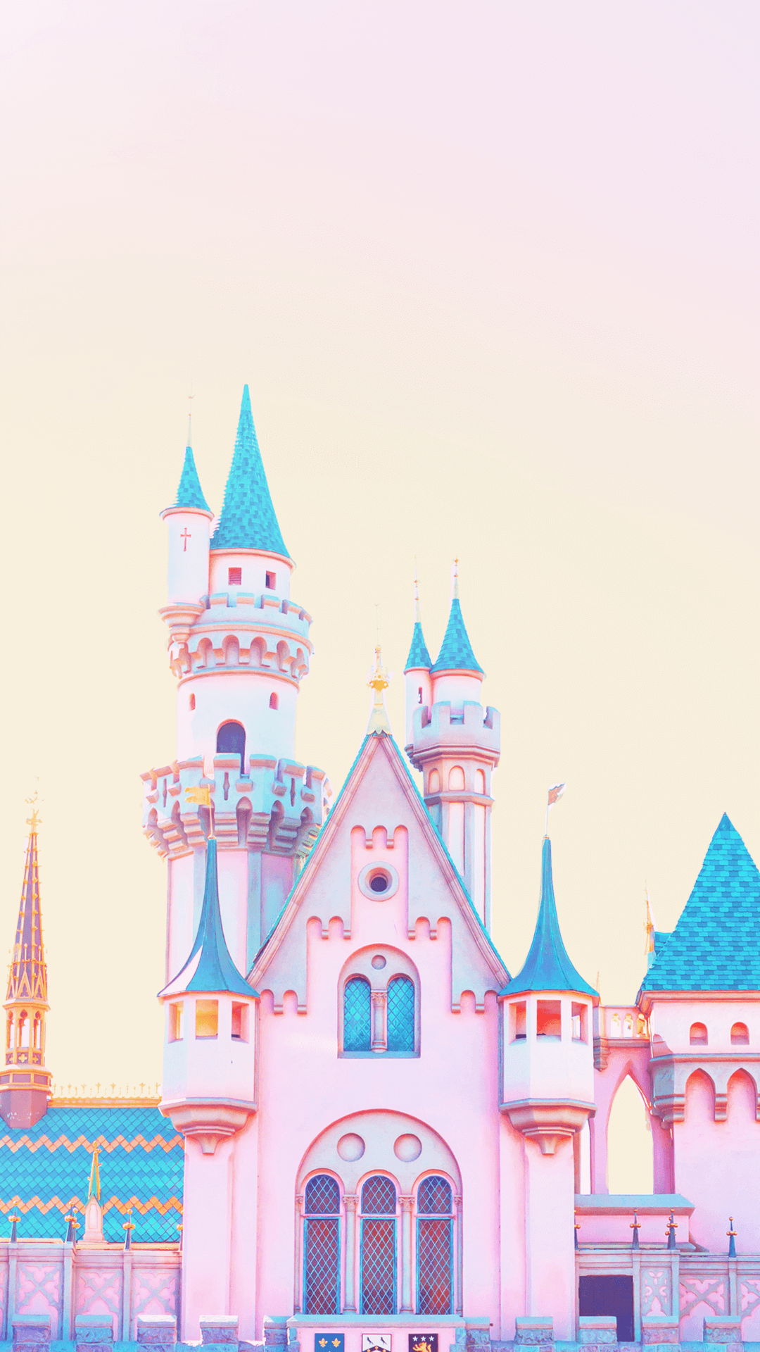 A pink castle with a sky background - Disneyland