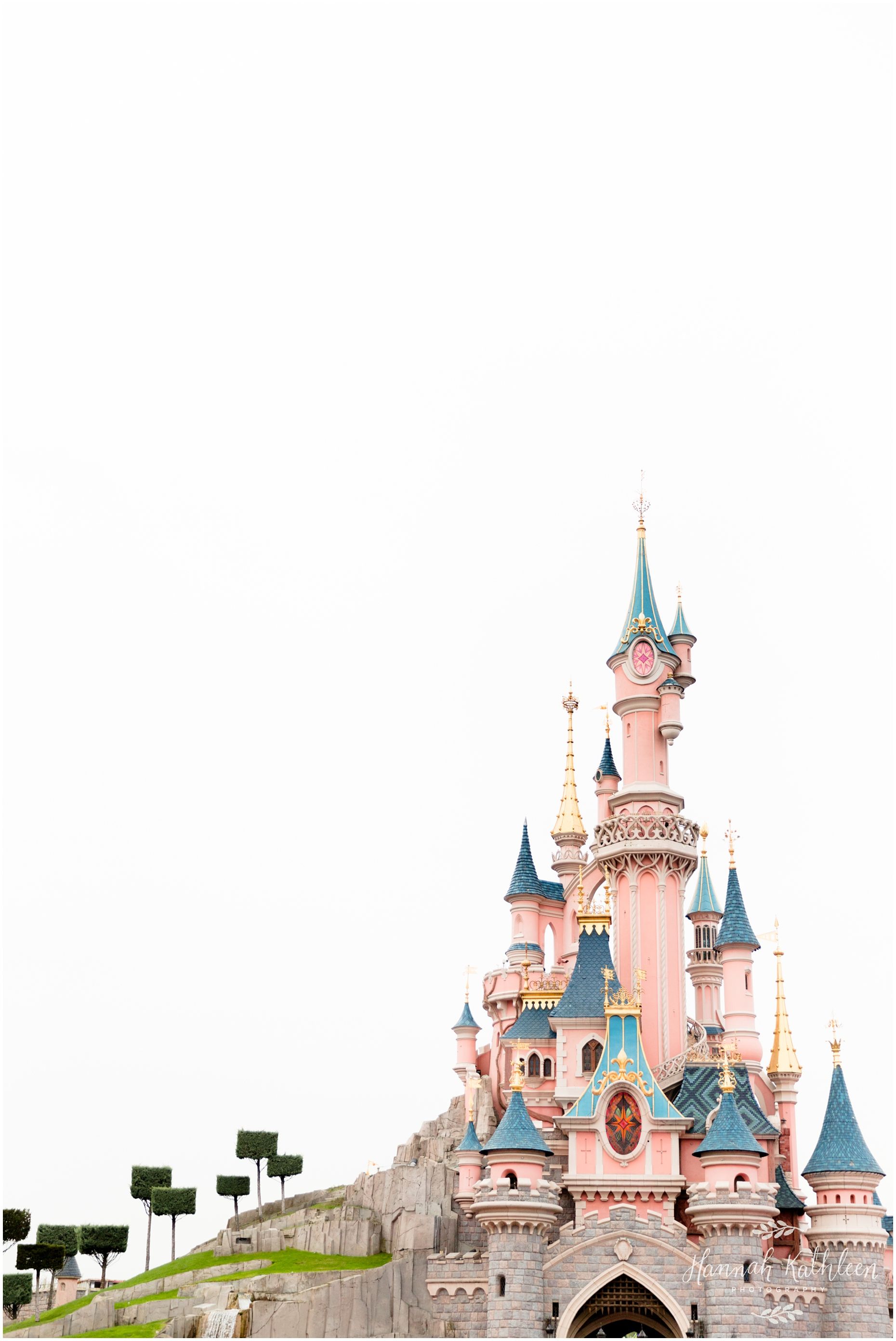 A castle with blue and pink towers - Disneyland