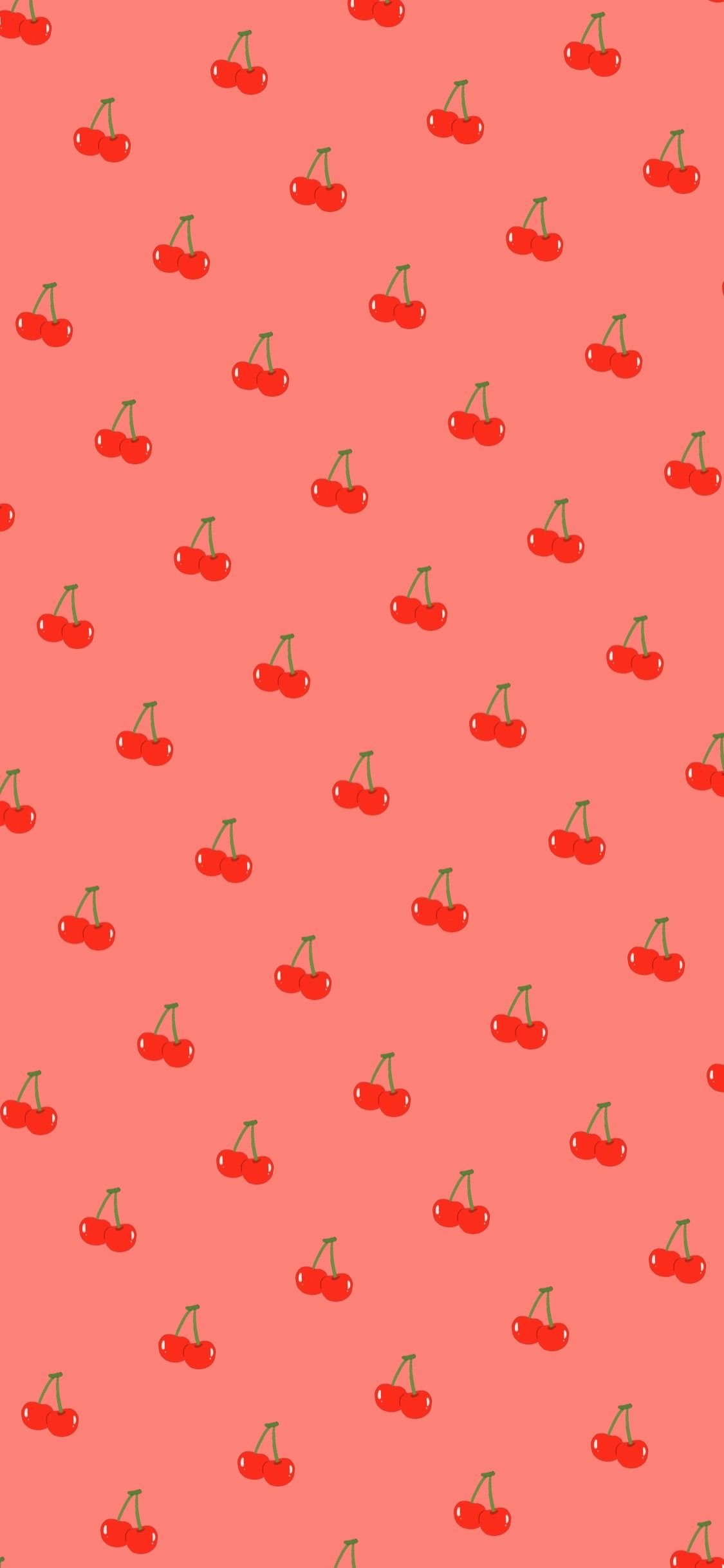 A pattern of red cherries on a salmon background - Cherry