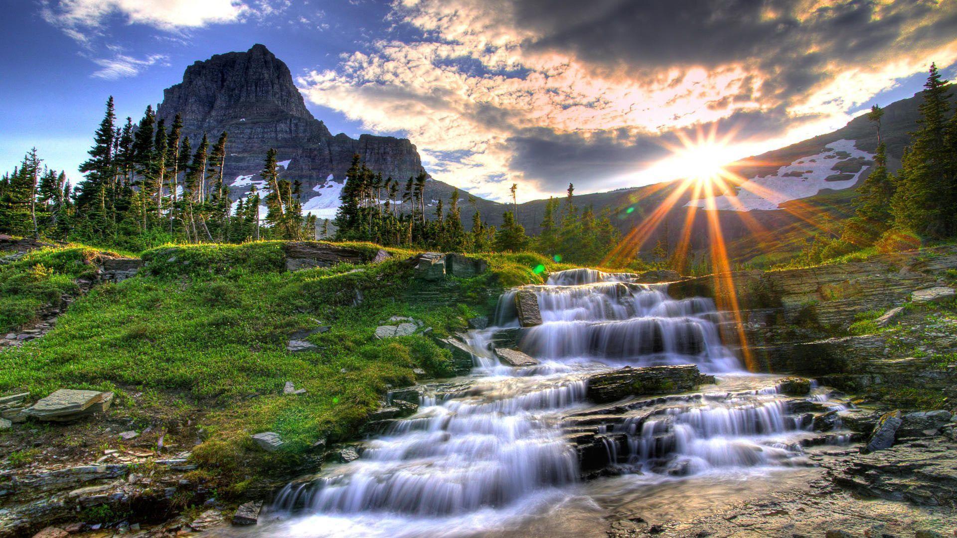 1920x1080 desktop wallpaper of a waterfall in the mountains with the sun rising - Nature