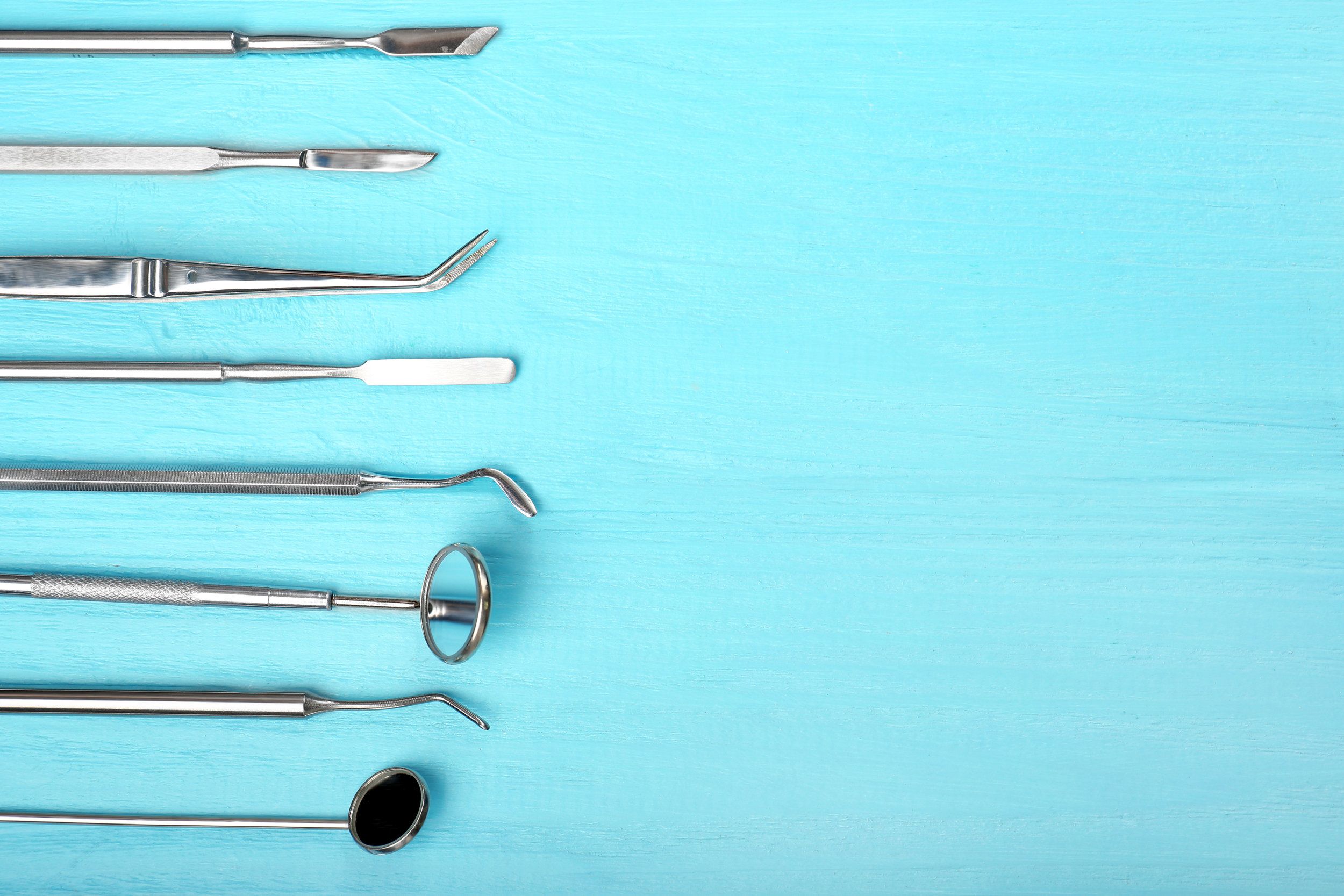 A row of dental tools on top - Dentist