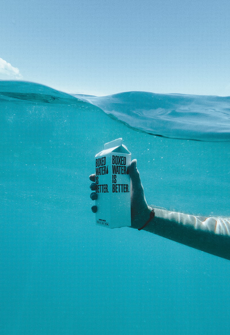 Person holding boxed water underwater, HD phone wallpaper