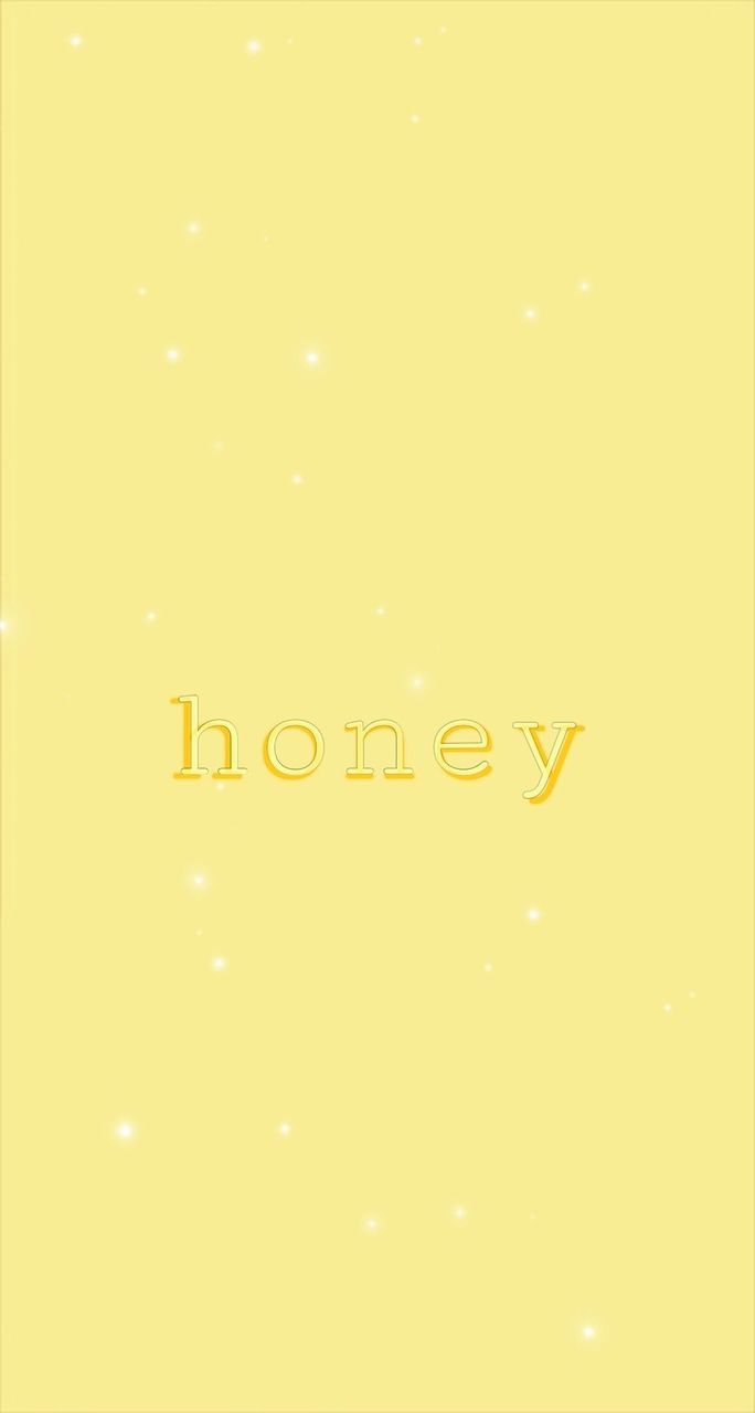 A yellow background with the word honey in white - Honey