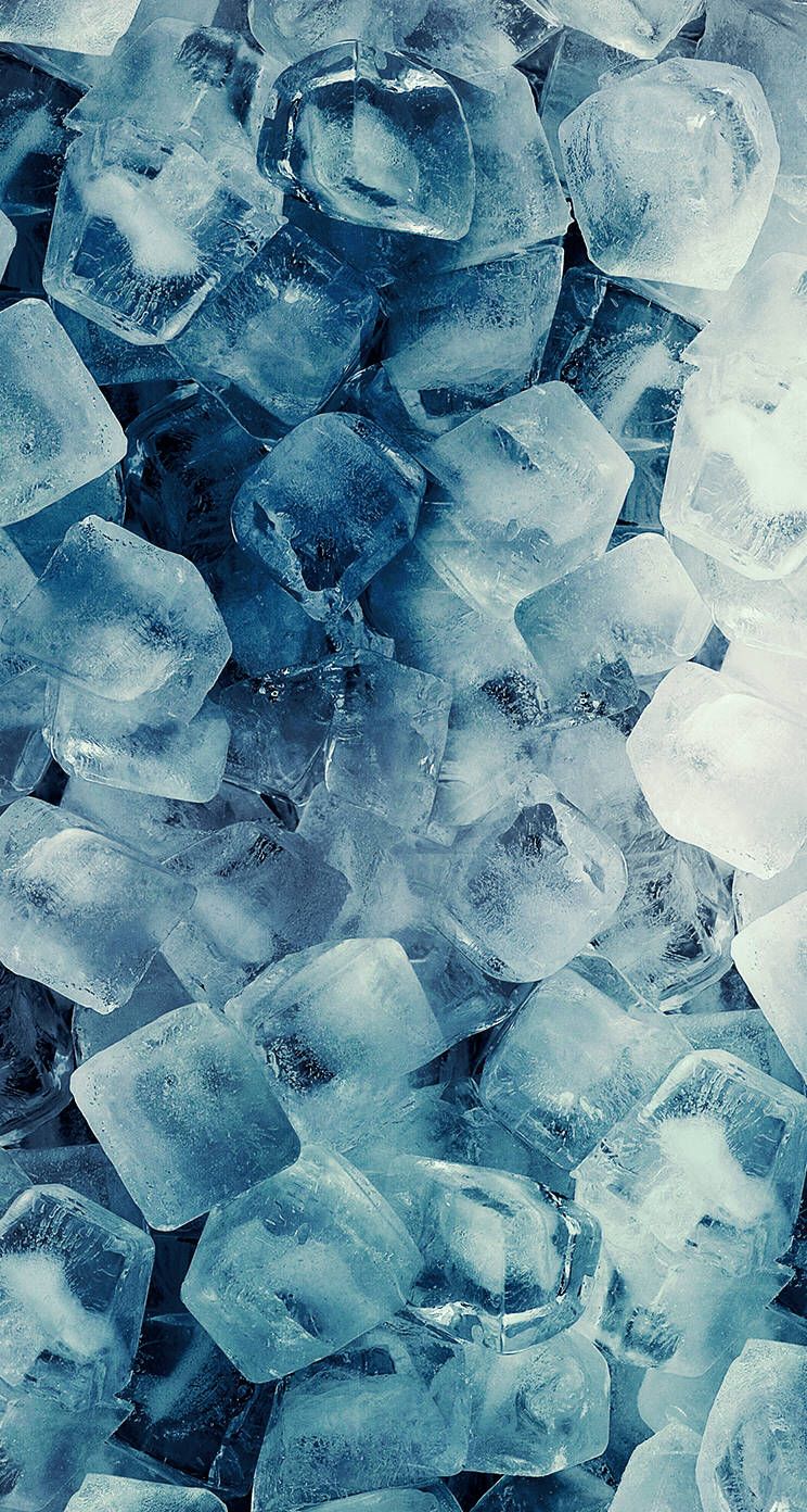 A close up of ice cubes in water - Ice