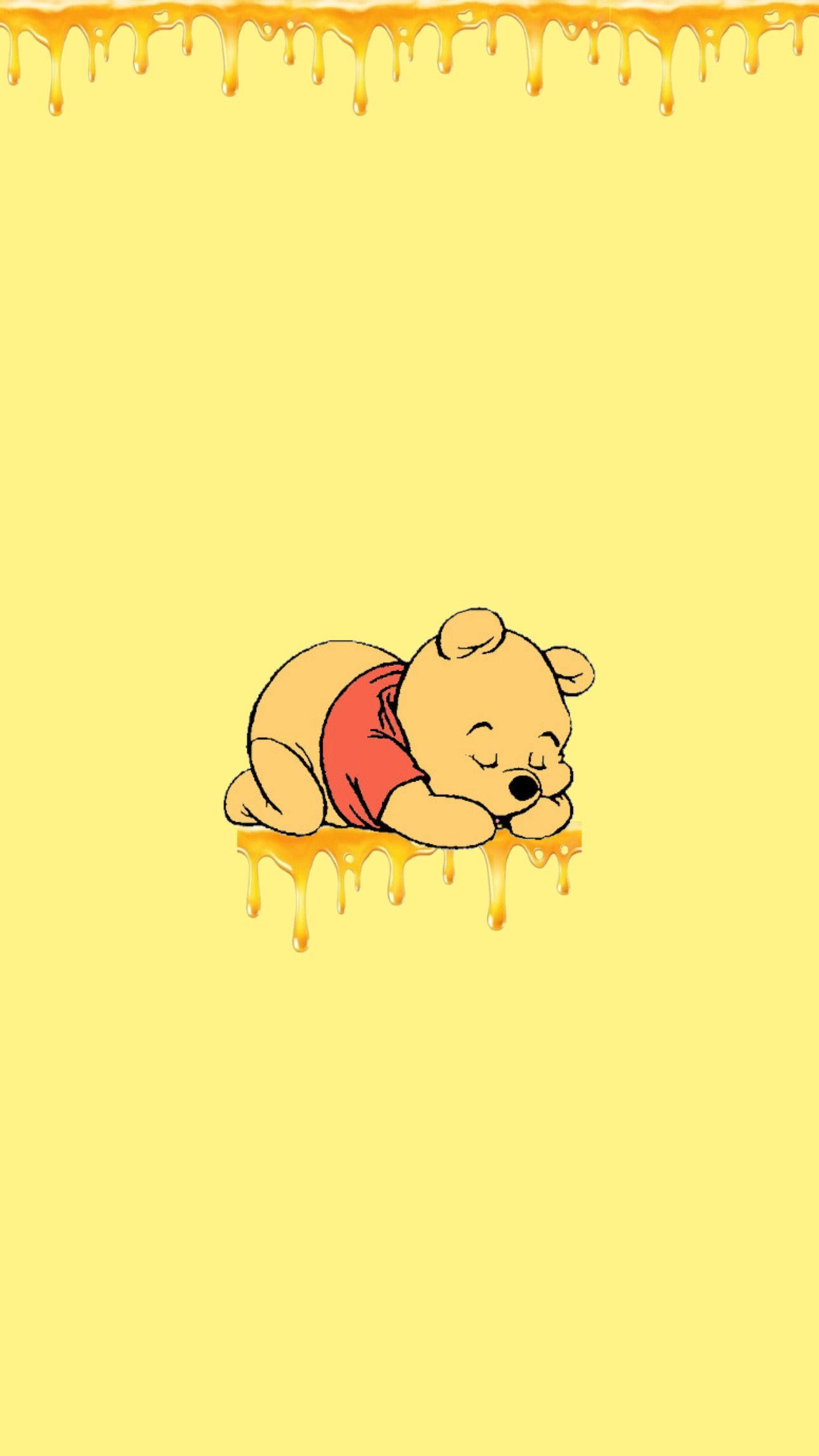Winnie the pooh sleeping on a yellow background - Honey