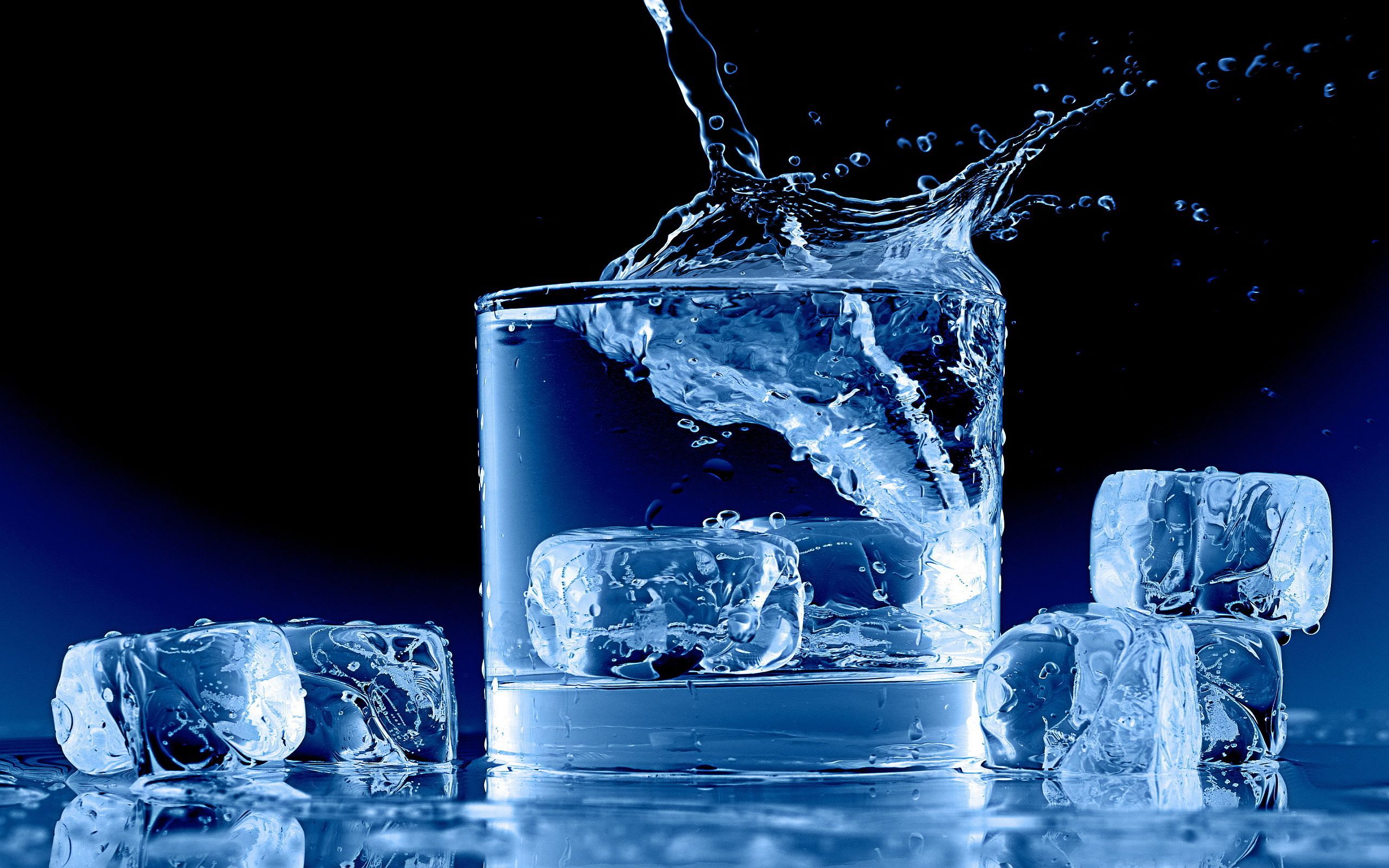 A glass of water with ice cubes - Ice