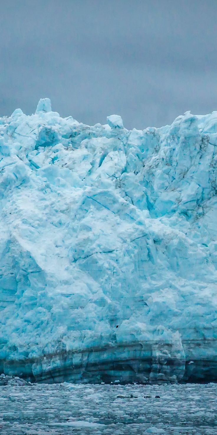 A large iceberg floating in the ocean - Ice