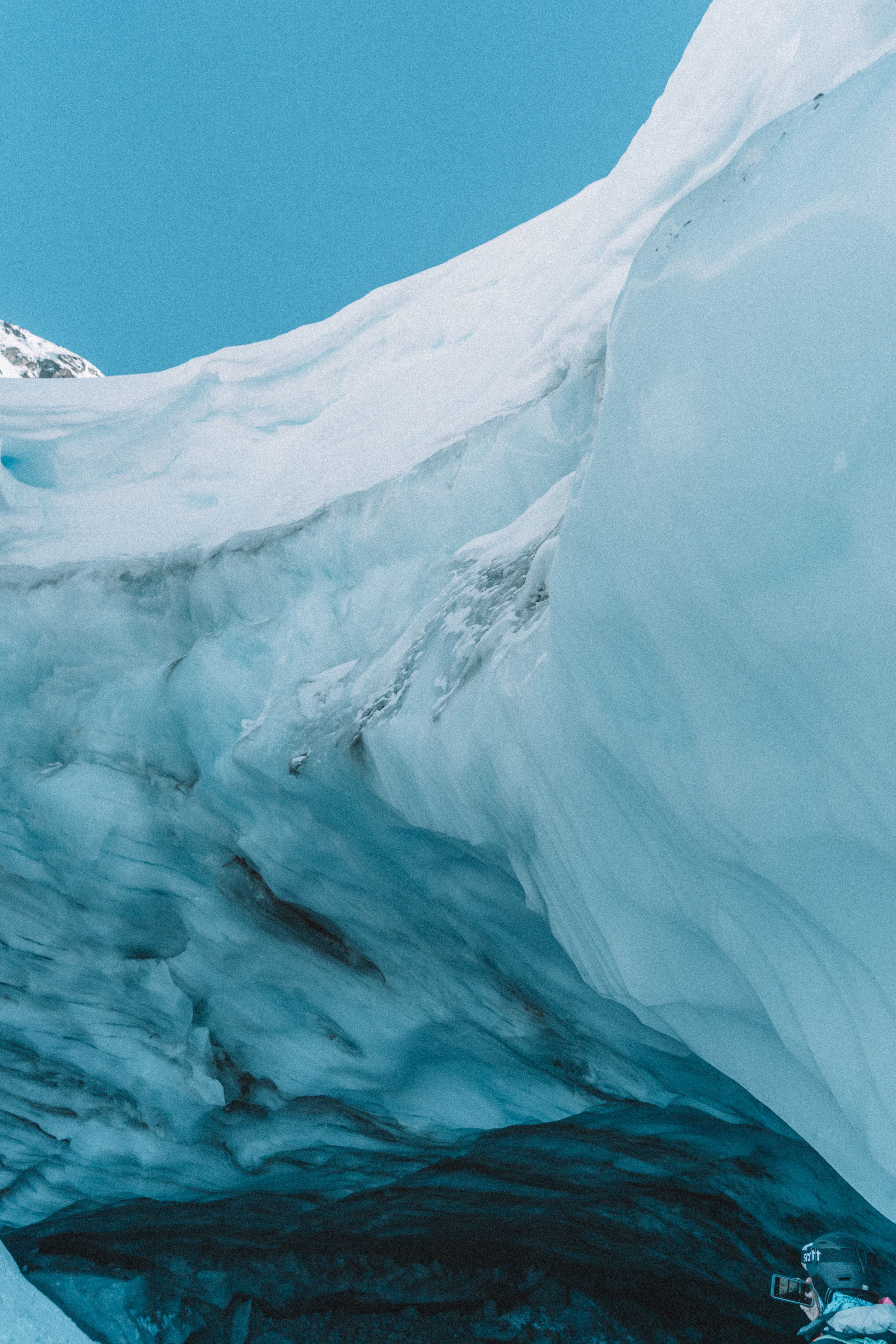 A close up of a large, tall ice wall. - Ice